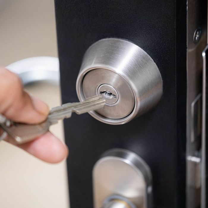 Person Using Door Keys