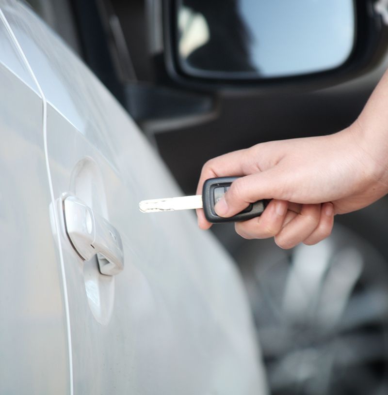 Person Inserting Car Key