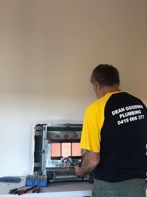 Fixing Gas Heater — Dean Goodwin Plumbing Pty Ltd in Shellharbour, NSW