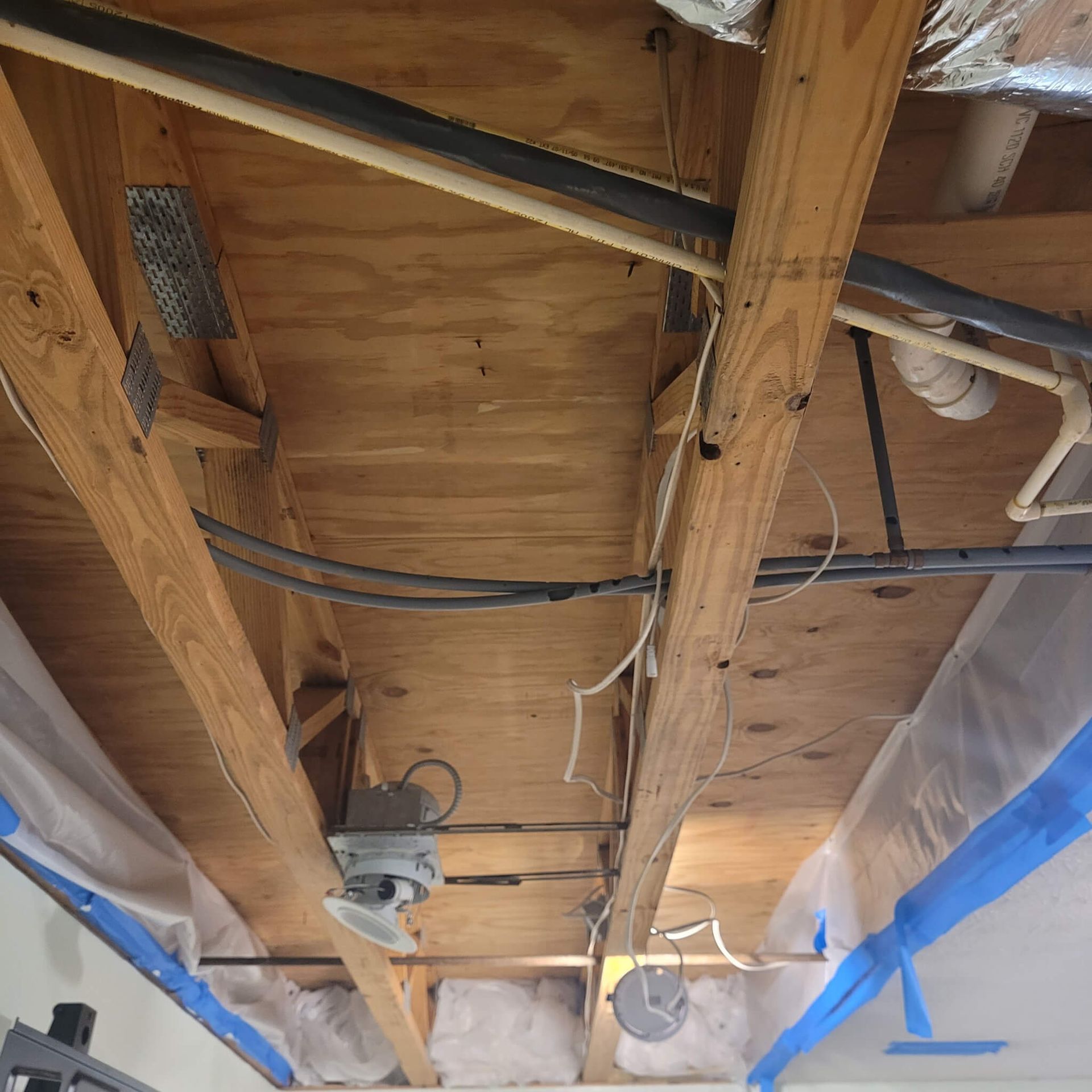 A ceiling with a lot of wires hanging from it