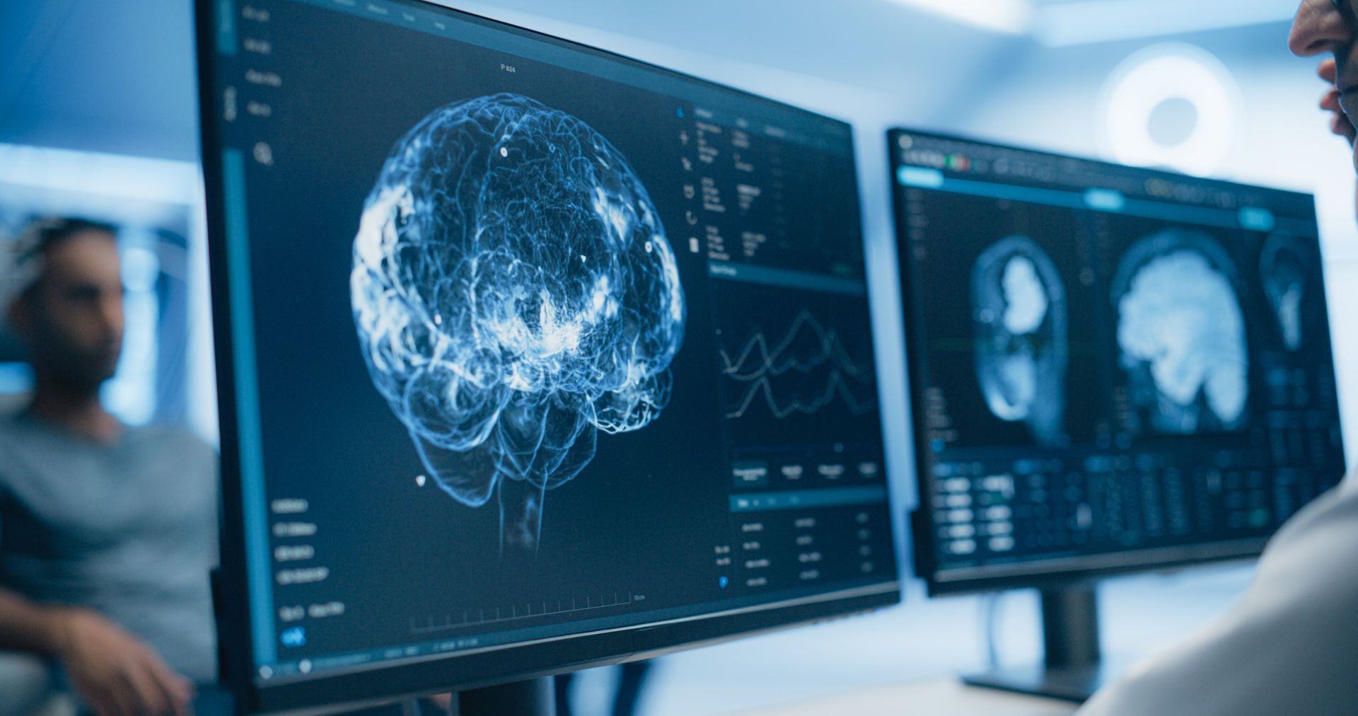 Two monitors display detailed brain scans and data during a neurosurgical consultation Two monitors display detailed brain scans and data during a neurosurgical consultation
