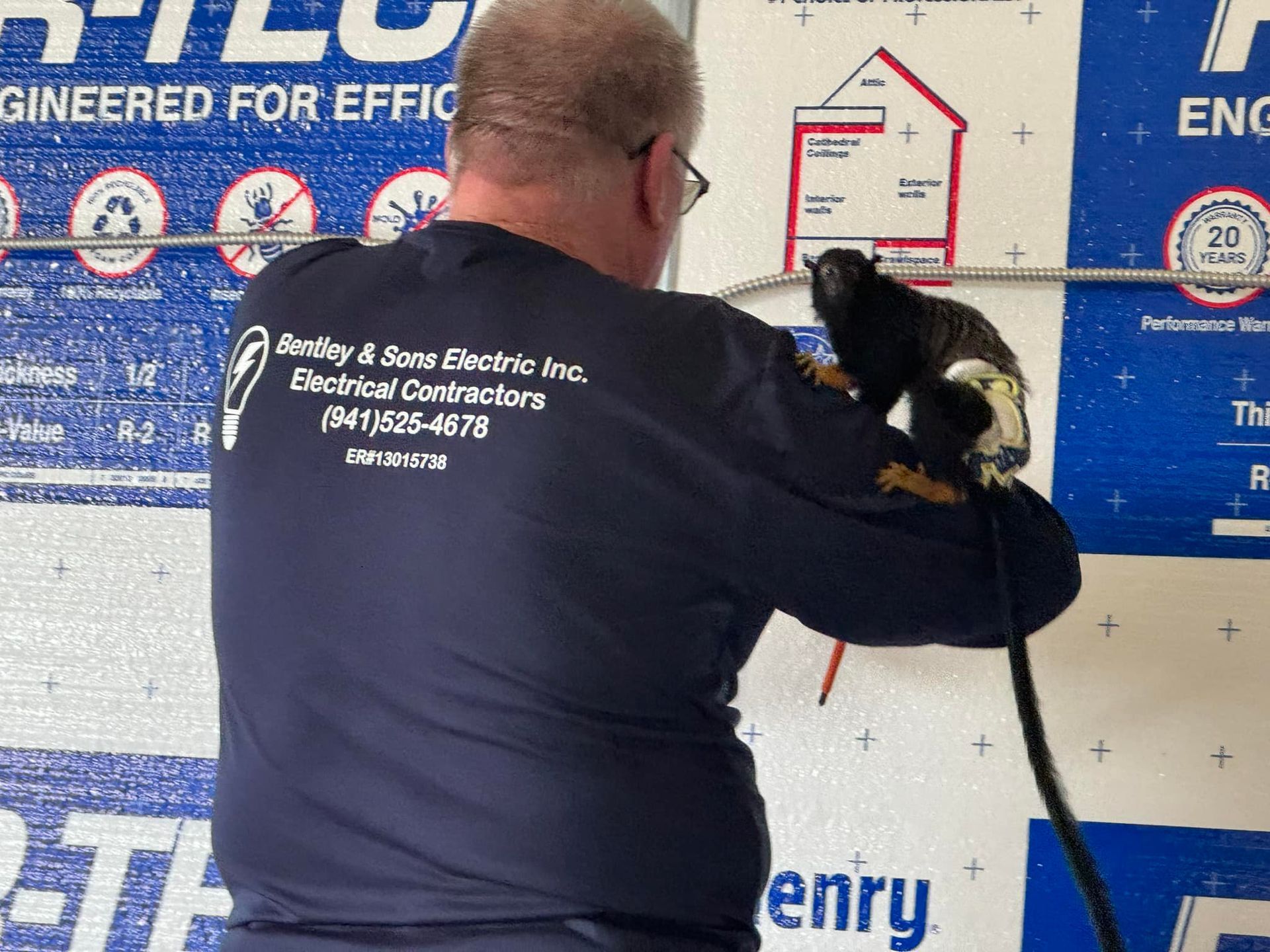 A man wearing a shirt that says engineered for efficiency