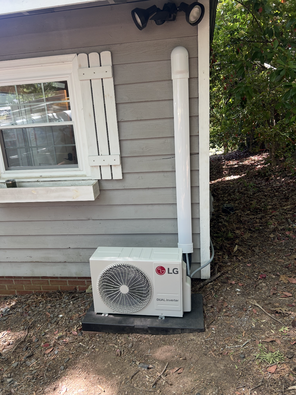 HVAC installation technician performing a Manual J load calculation in Asheboro, NC.