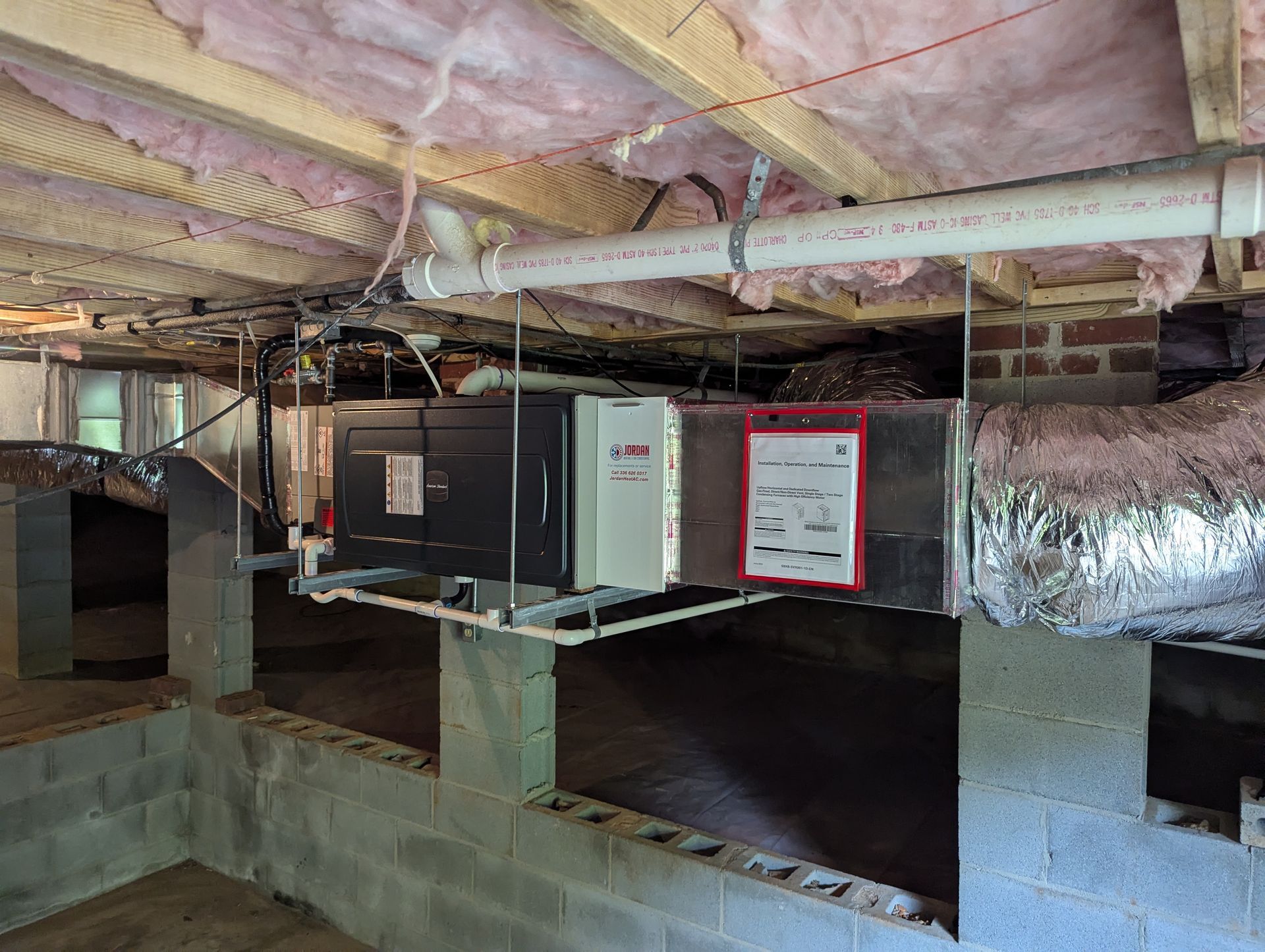 Emergency AC repair technician resolving a late-night system breakdown in Asheboro, NC.