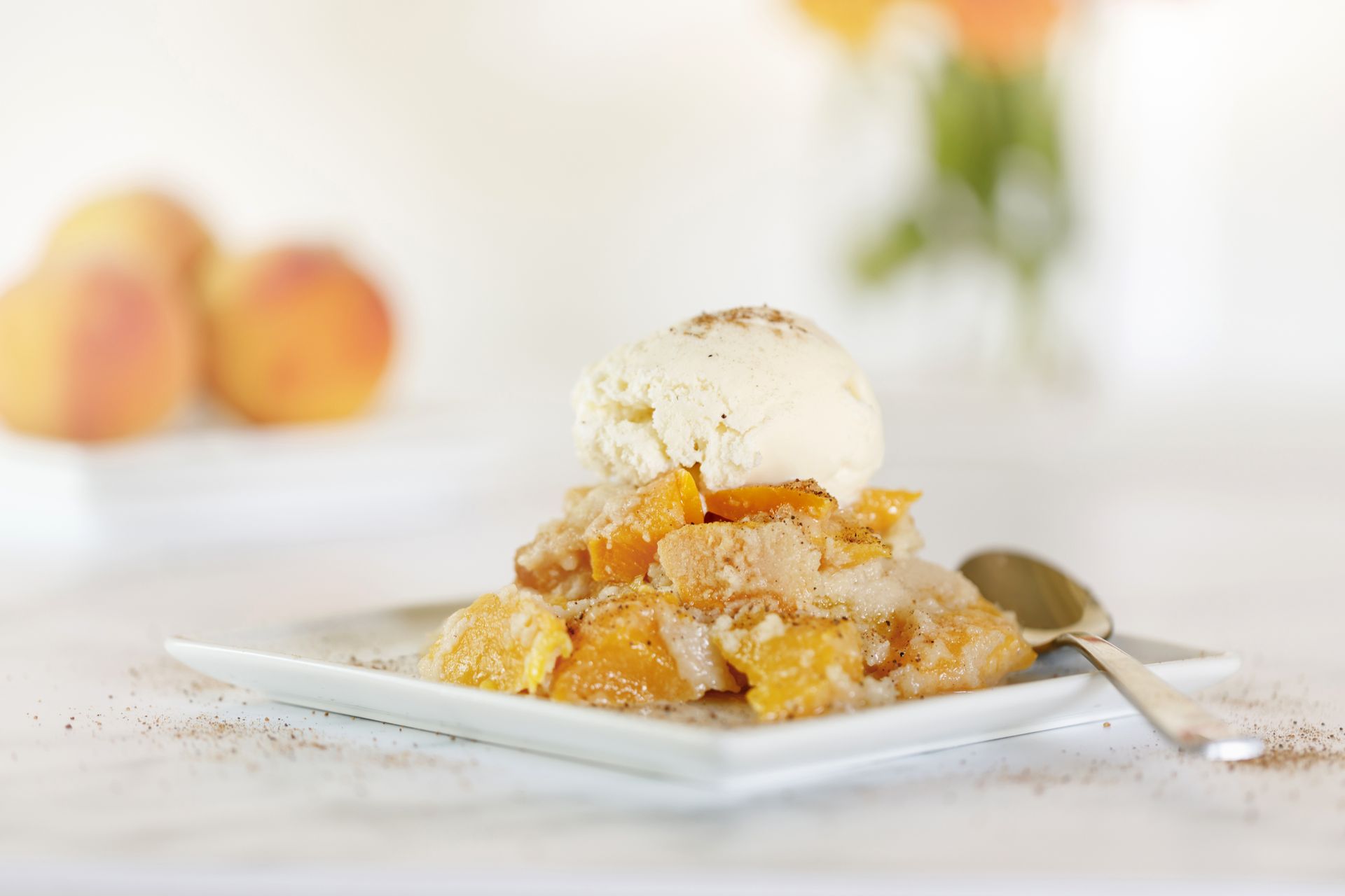 Peach cobbler with ice cream.