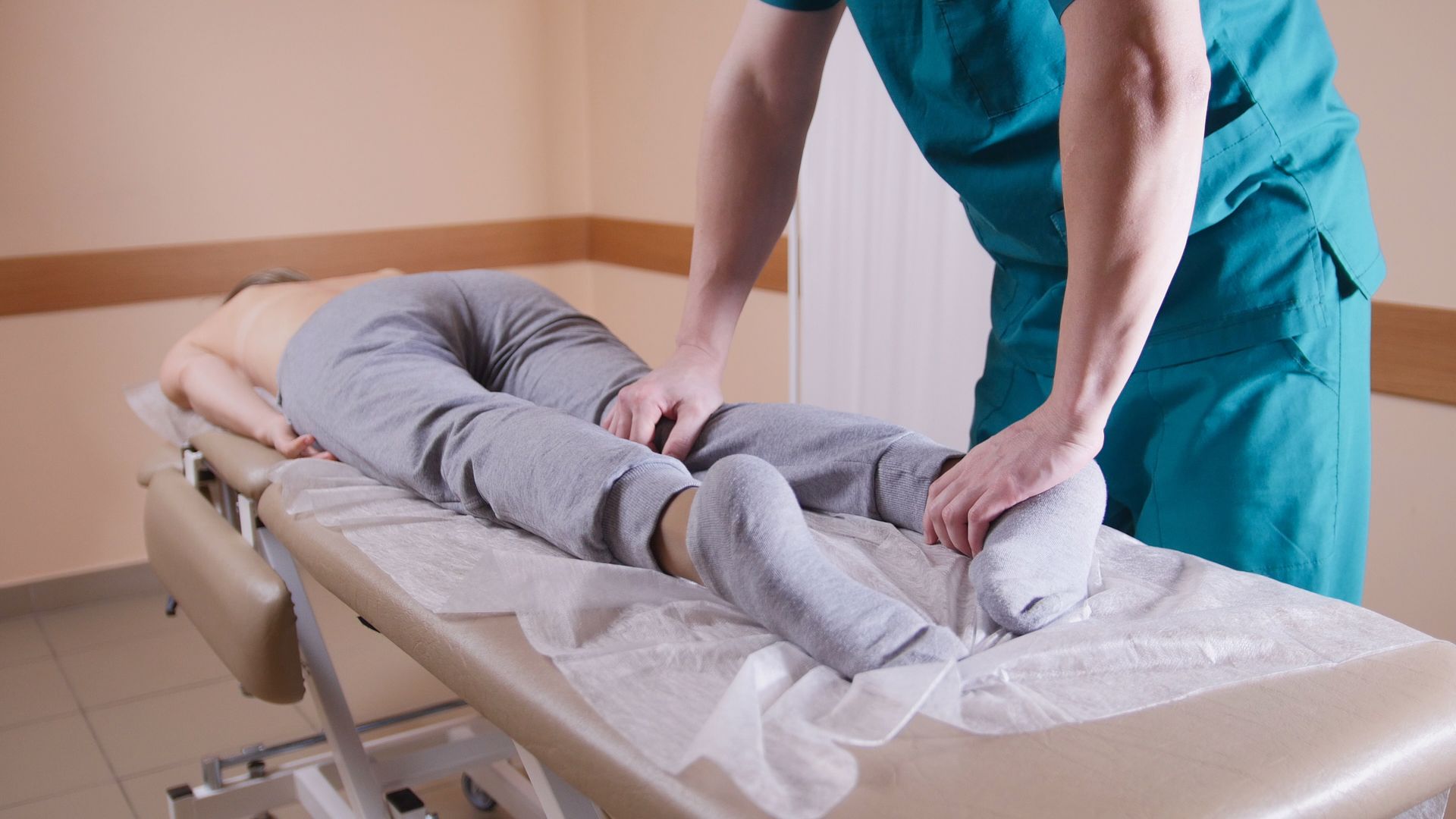 A doctor is giving a patient a massage on a table - Casper, WY - Miller Chiropractic Clinic