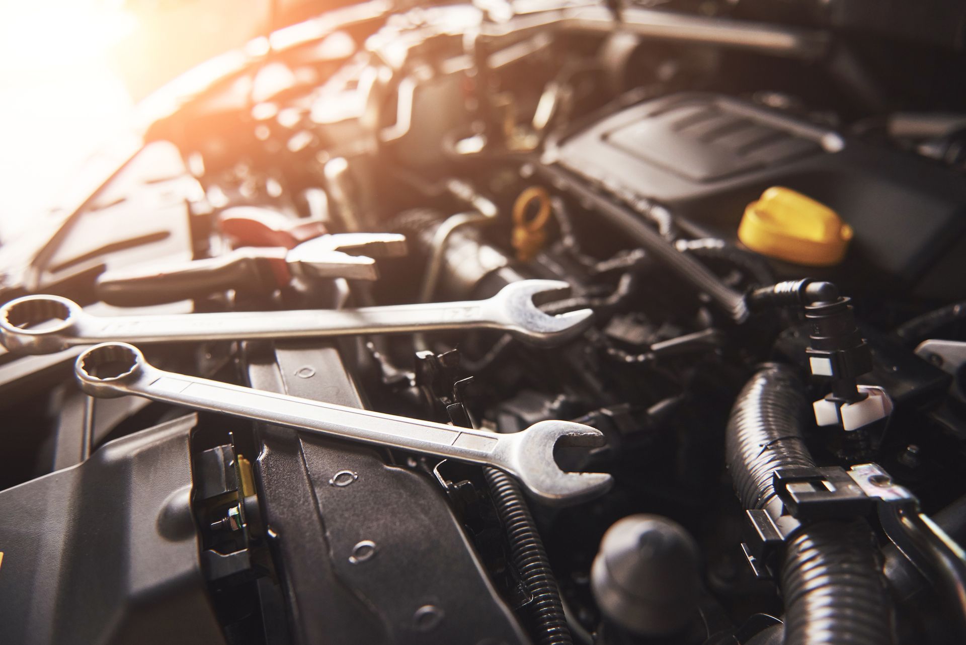 Tools over a car engine.