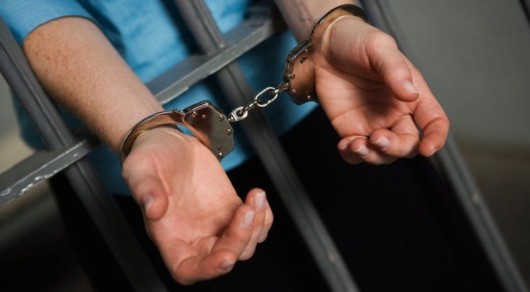 Hands Wearing Handcuffs