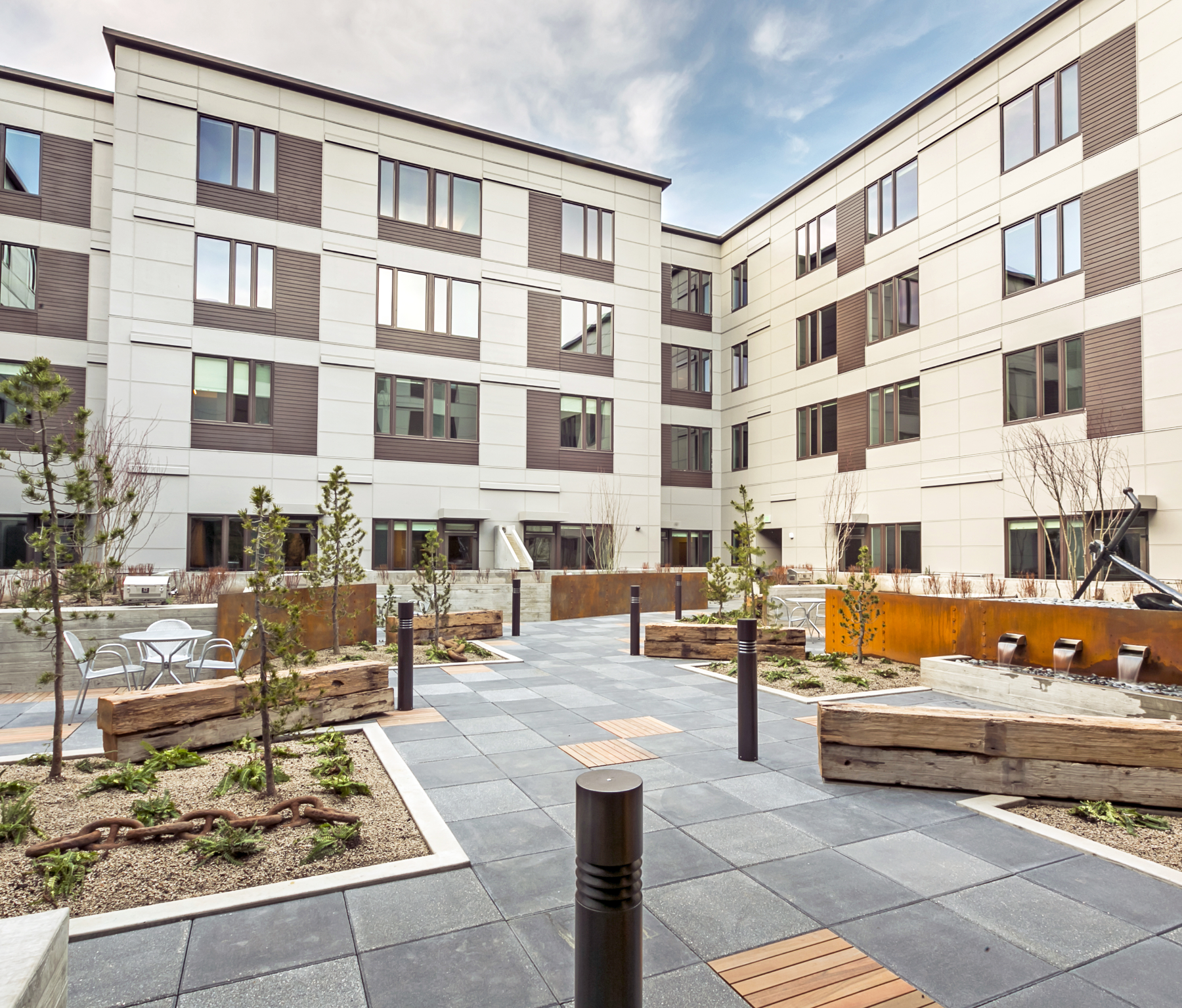 A large building with a courtyard in front of it.