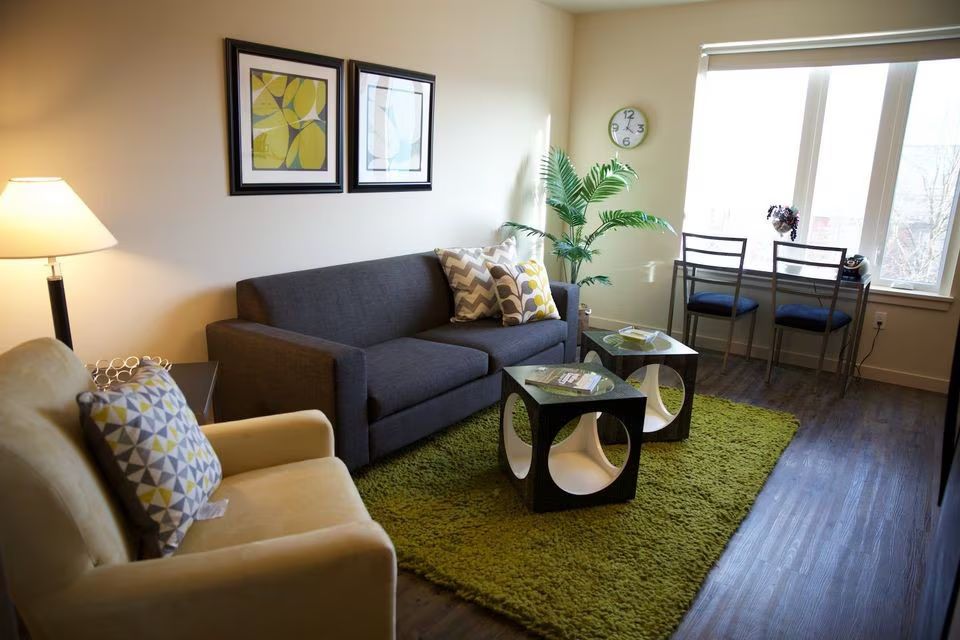 A living room with a couch and two coffee tables