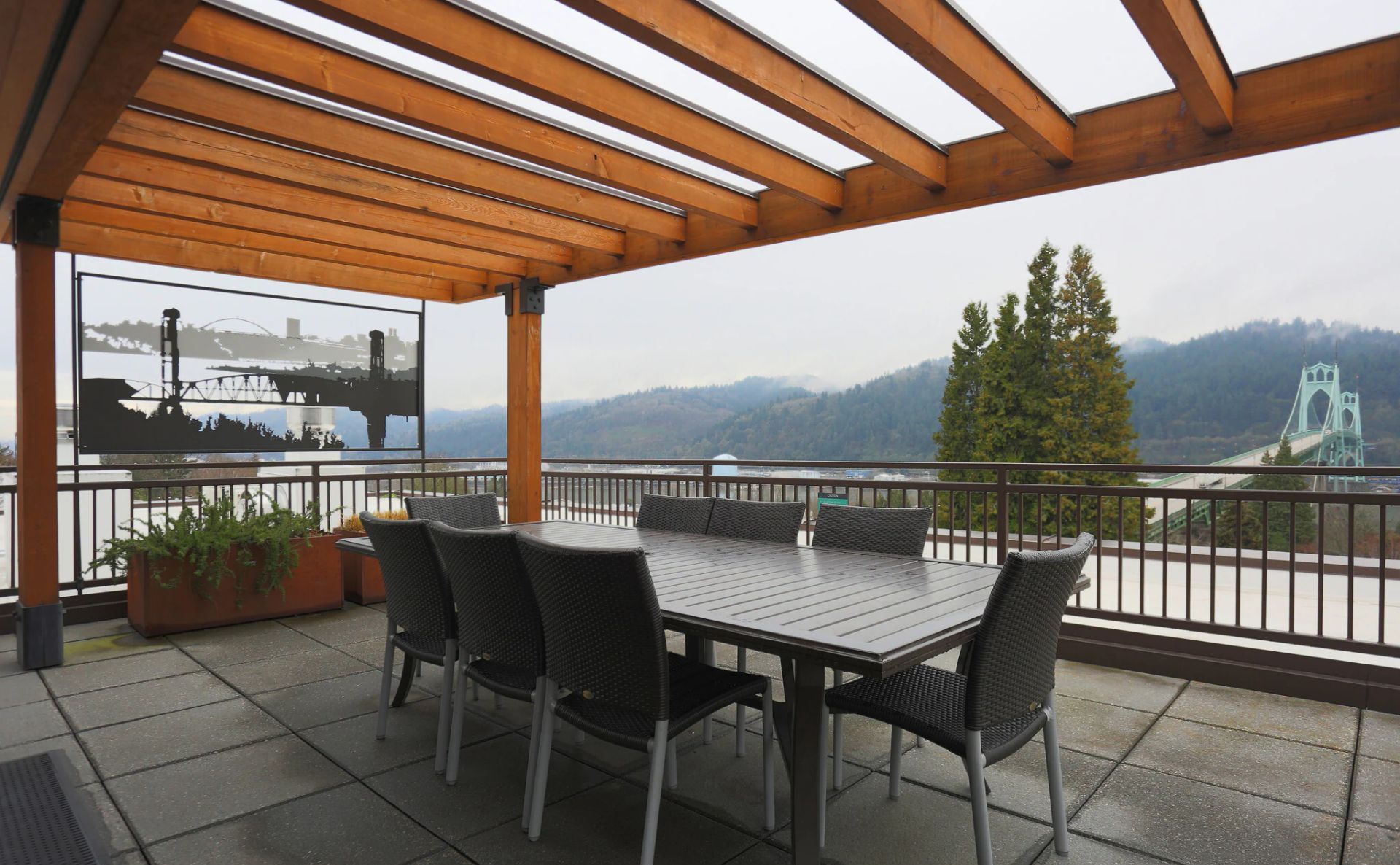 A patio with a table and chairs under a pergola