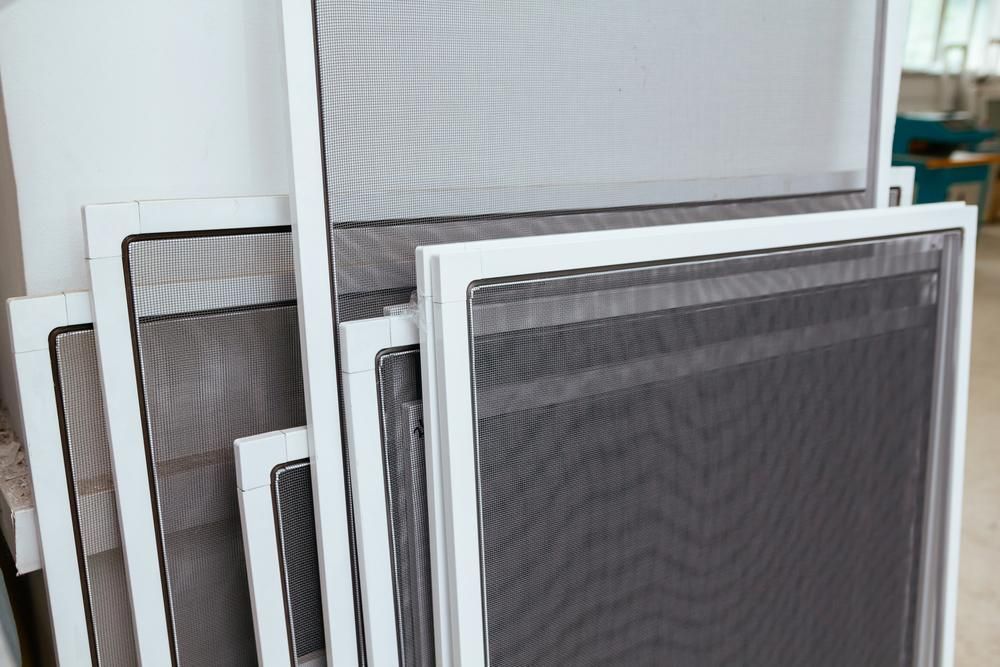 A Stack of White Door Screens