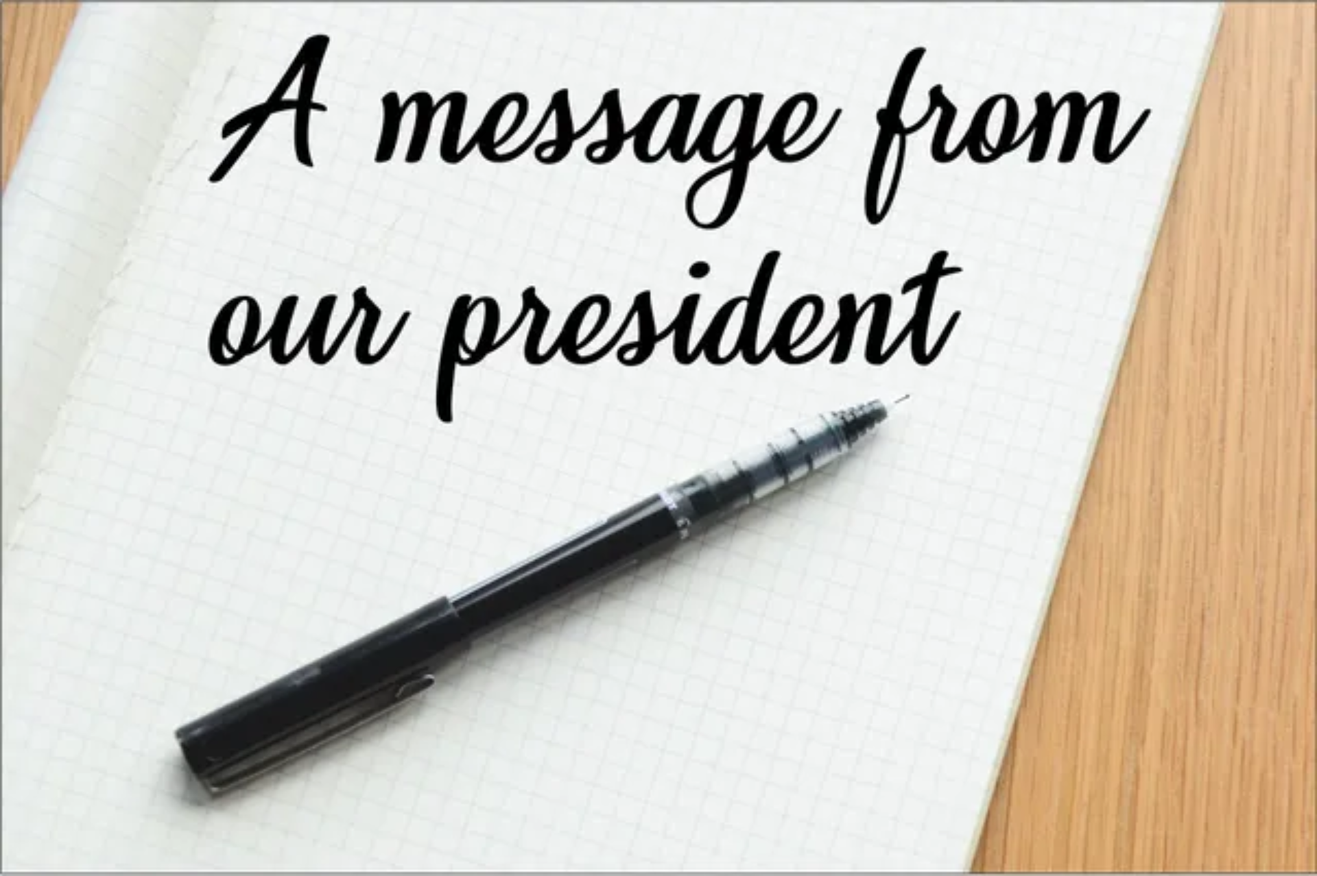 A message from our president with a picture of a piece of paper and pencil