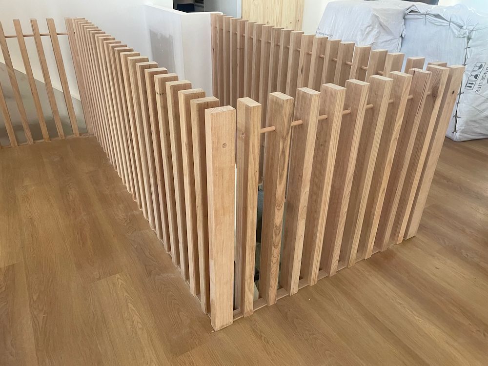 Wooden Slatted Railing Installed on a Staircase, Natural Wood Color — On The Rise Builders in Maroochydore, QLD