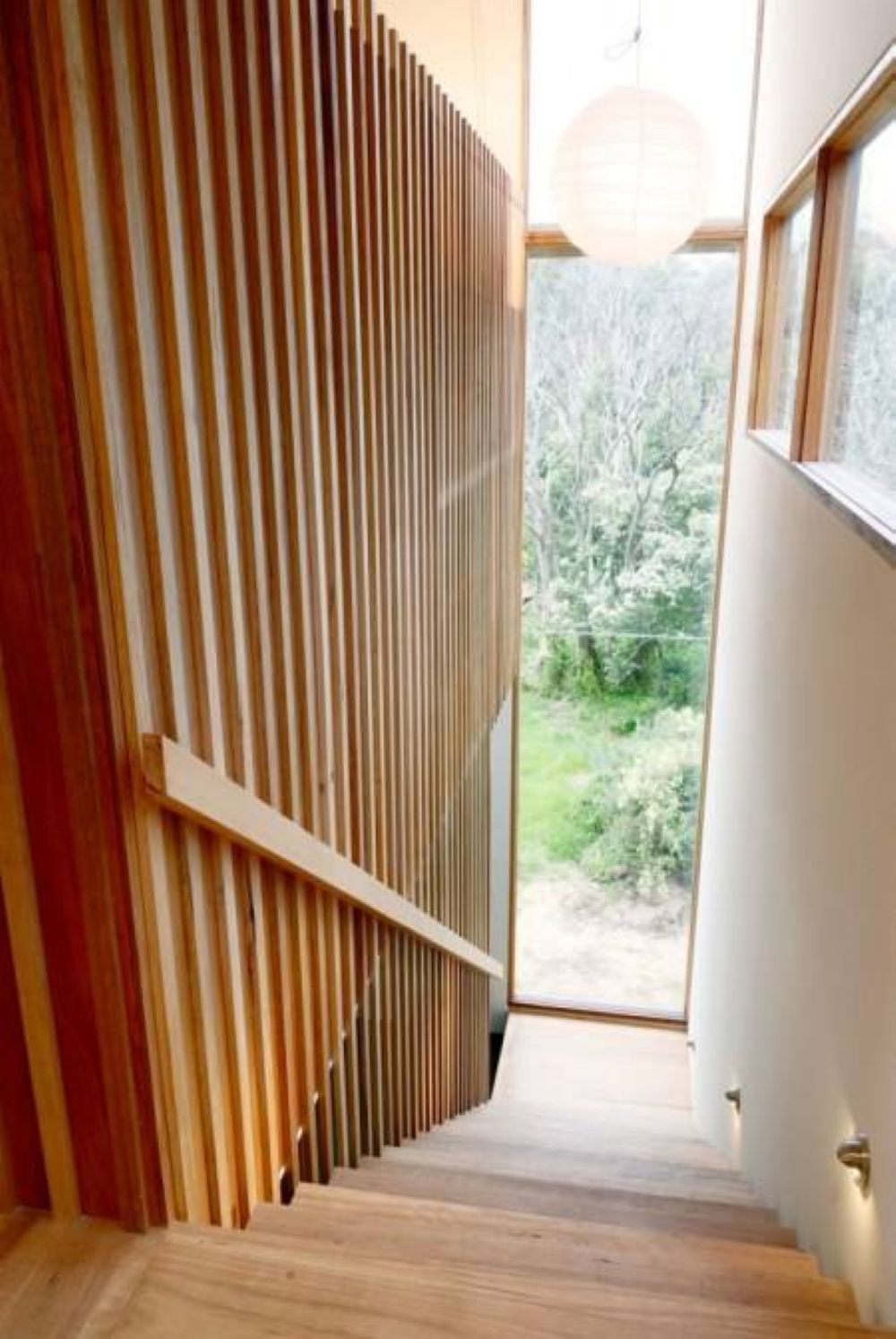 Wooden Staircase with Vertical Wood Paneling — On The Rise Builders in North Arm, QLD
