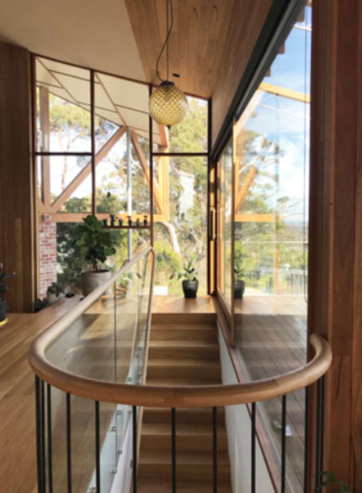 Wooden Staircase with Glass Railing, Large Windows — On The Rise Builders in Maroochydore, QLD