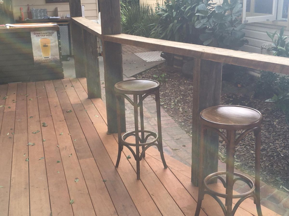 Wooden Deck with Two Bar Stools by A Long Bar — On The Rise Builders in Nambour, QLD