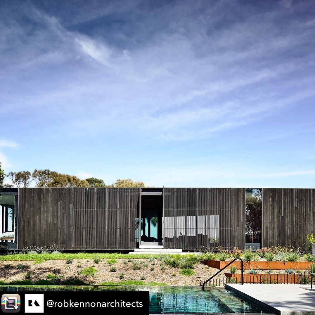 Modern wooden house with a pool under a blue sky. — On The Rise Builders in Maroochydore, QLD
