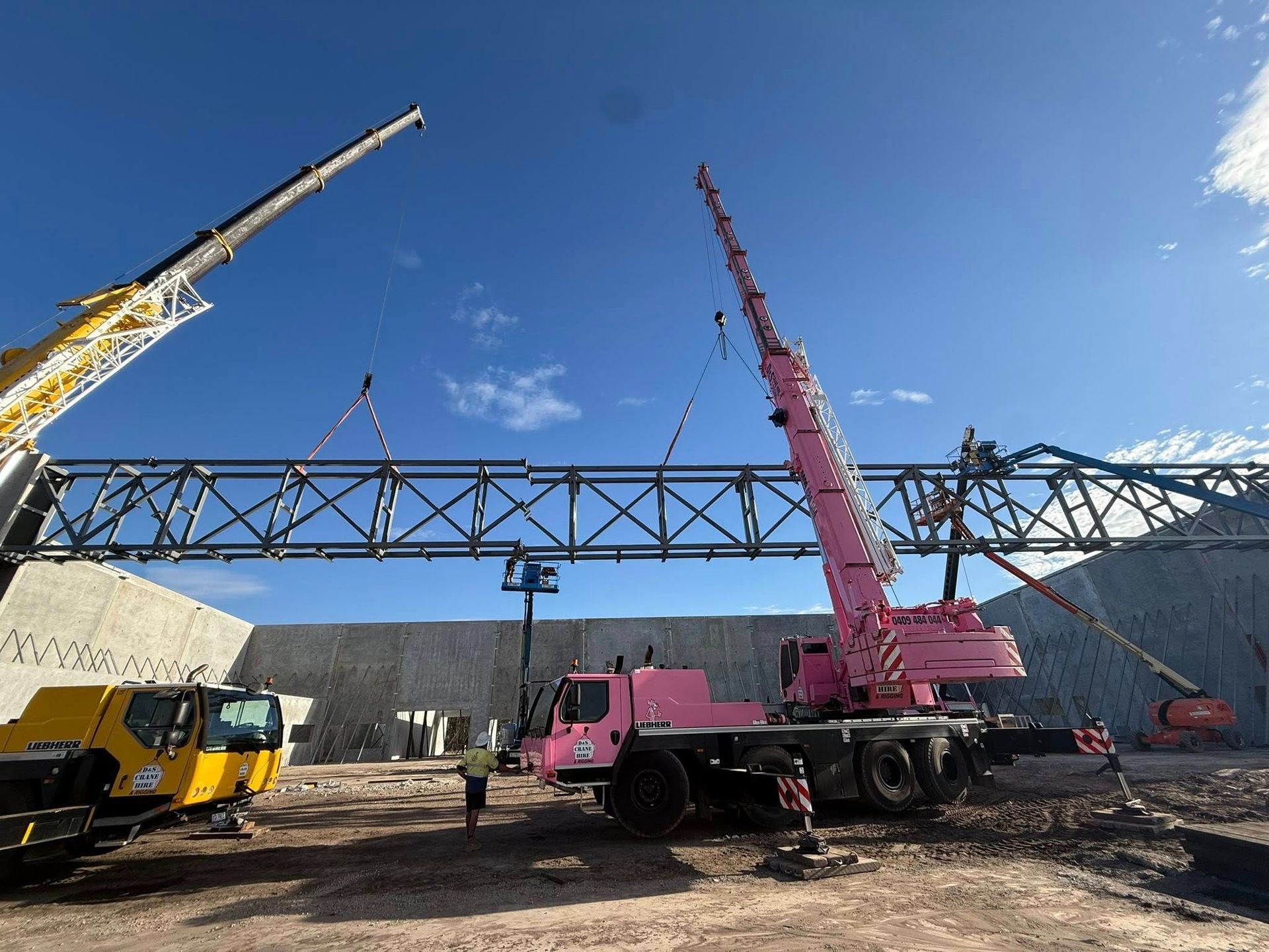 Large Crane Hires Lifting a Metal Truss