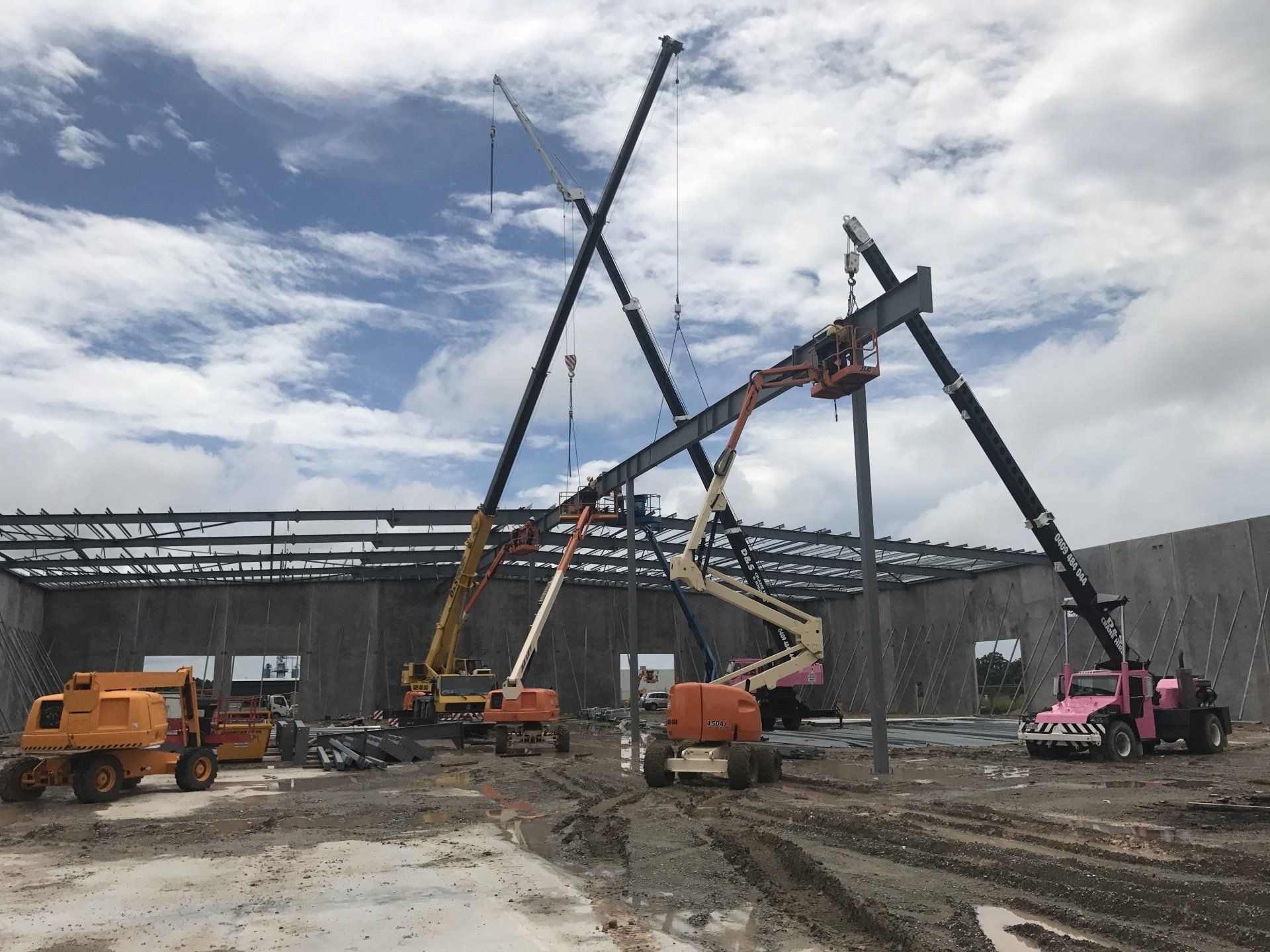 A Construction Site with A Lot of Trucks and Cranes —  D & S Crane Hire & Rigging In Kunda Park, QLD