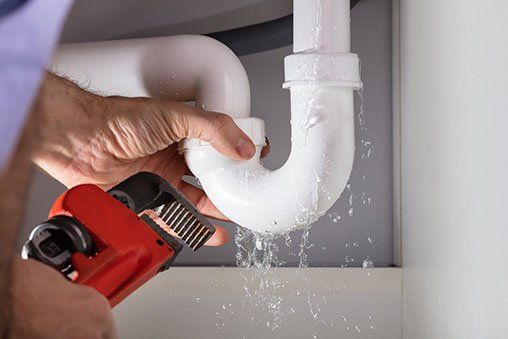 Plumber Fixing Sink Pipe — Bethesda, MD — Leahy Plumbing & Heating Inc.
