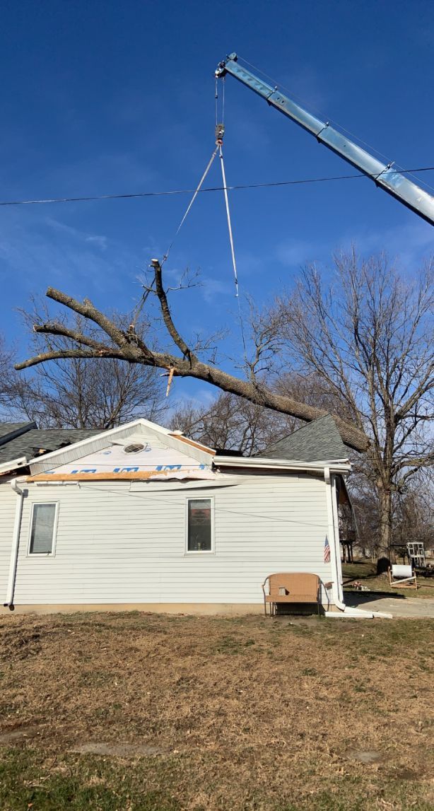 An emergency tree removal from a house in Des Moines, IA by Top Notch Tree Care