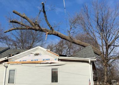 An emergency tree removal from a house in Des Moines, IA by Top Notch Tree Care