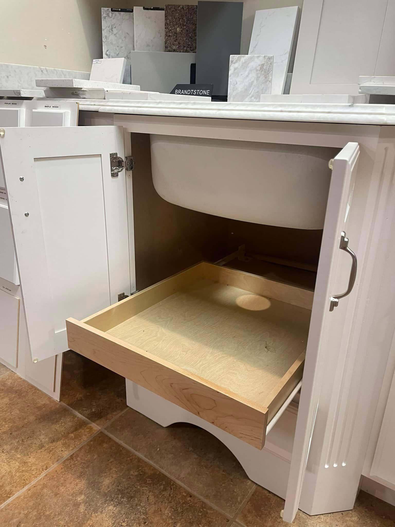 A bathroom sink with a drawer underneath it.