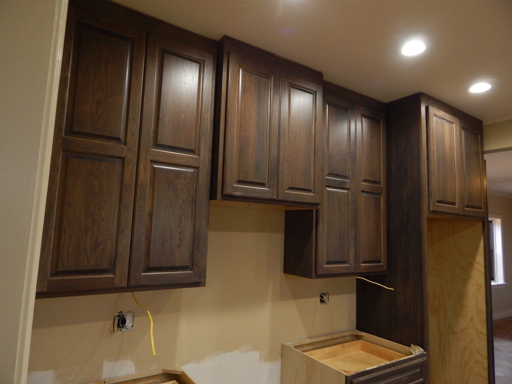 A kitchen with wooden cabinets and a counter top