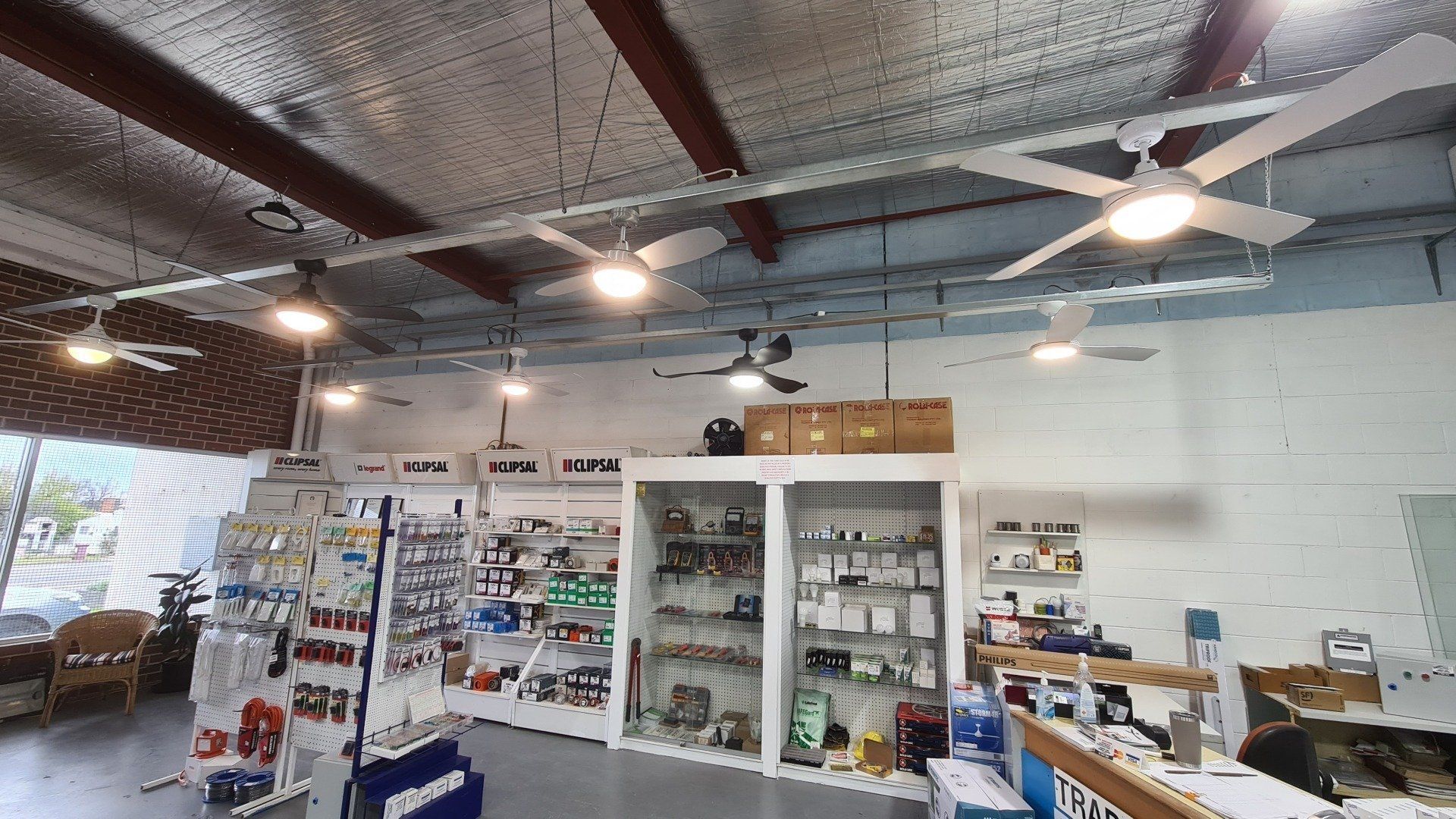 A store filled with lots of shelves and electrical supplies.