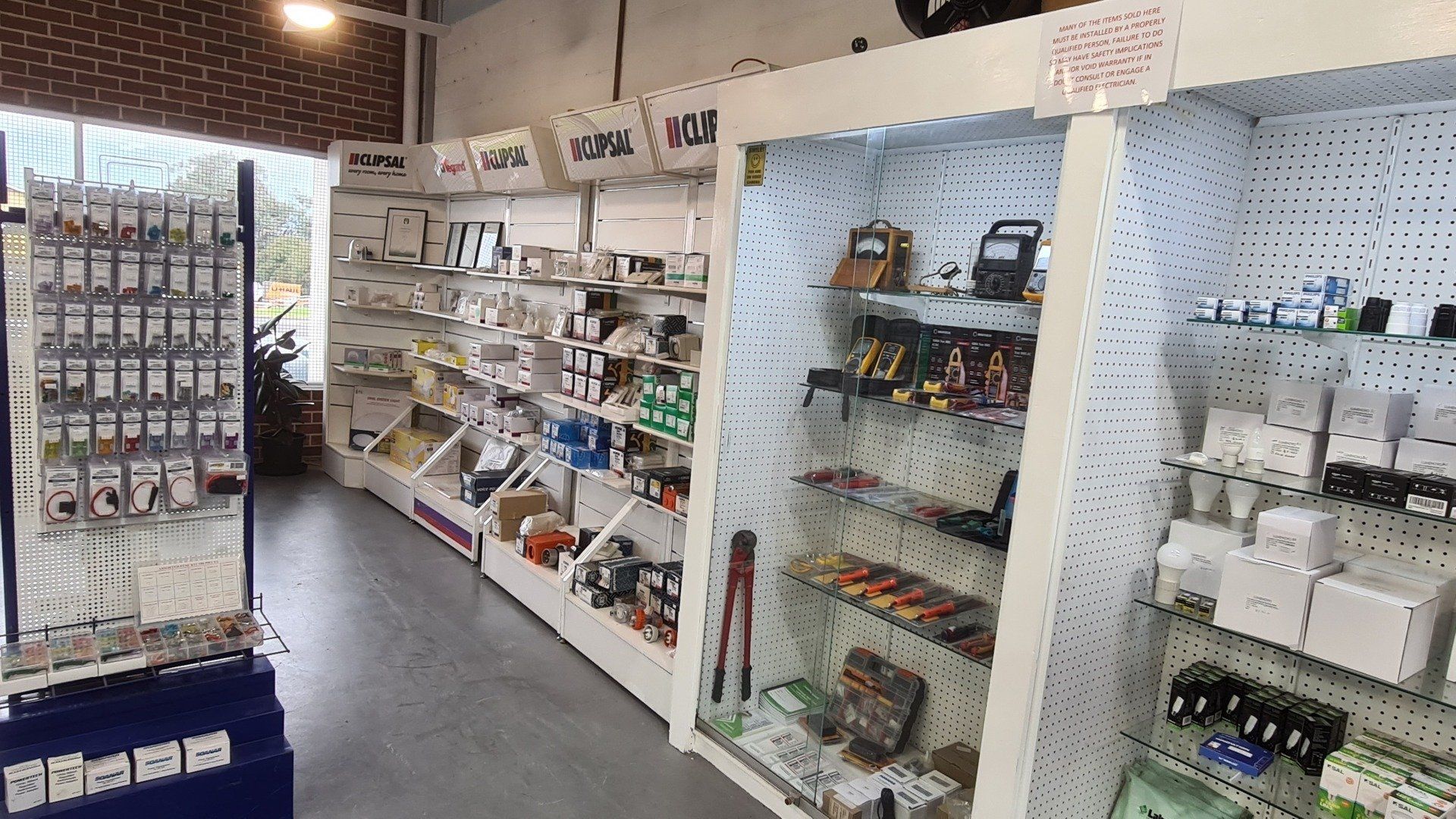 A store filled with lots of shelves and electrical supplies.