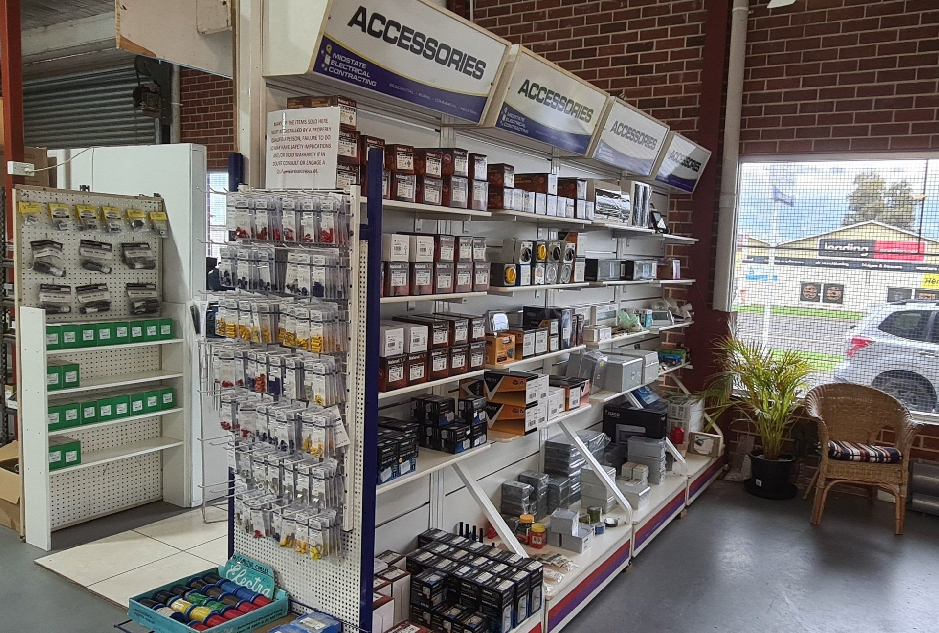 A store filled with lots of shelves and electrical supplies.