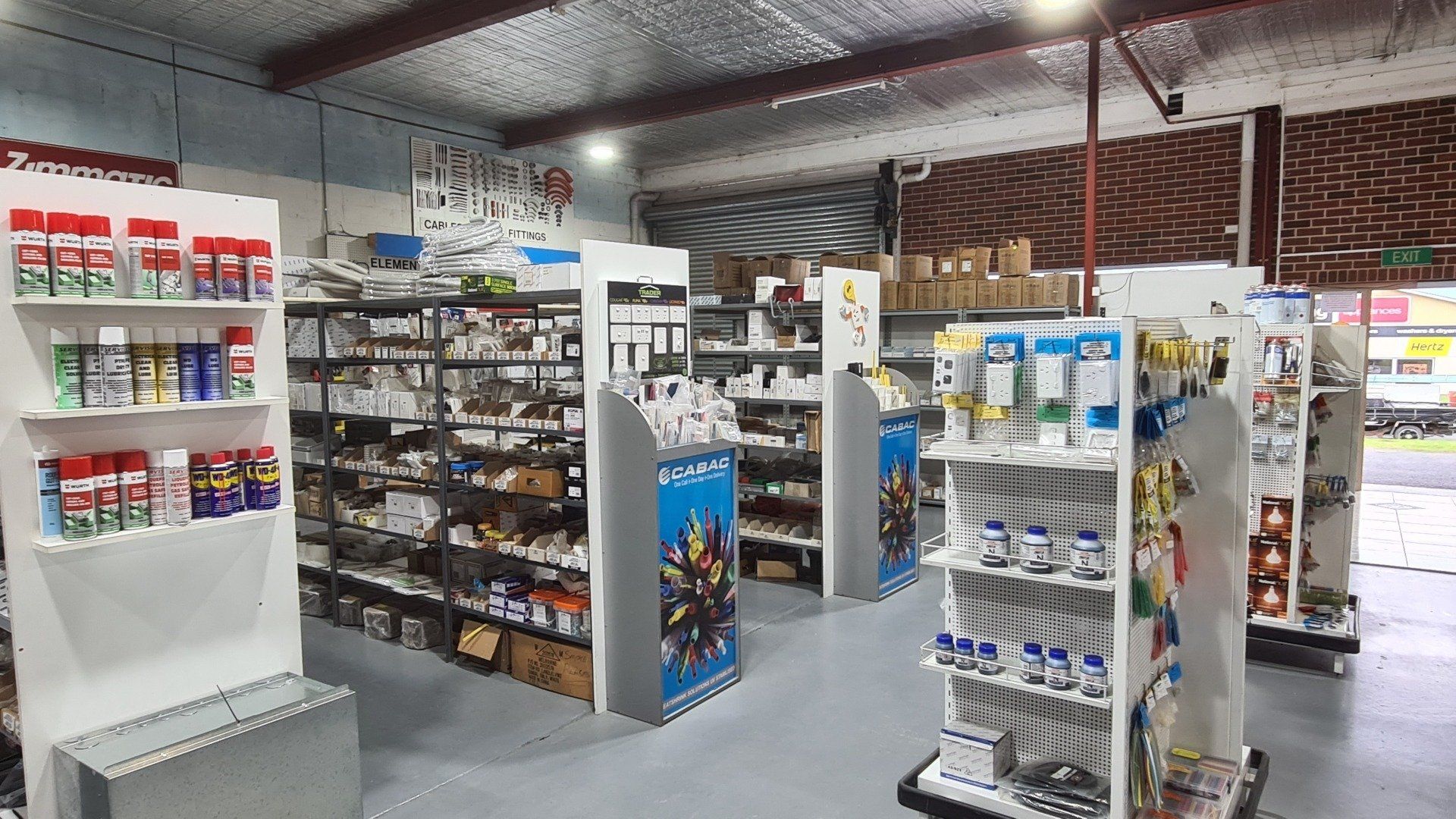 A store filled with lots of shelves and electrical supplies.