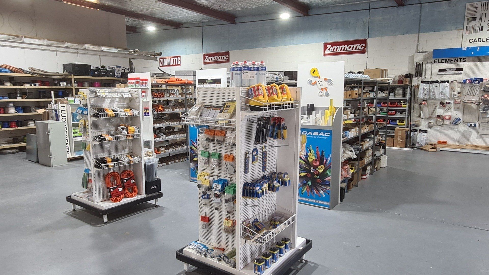 A store filled with lots of shelves and electrical supplies.