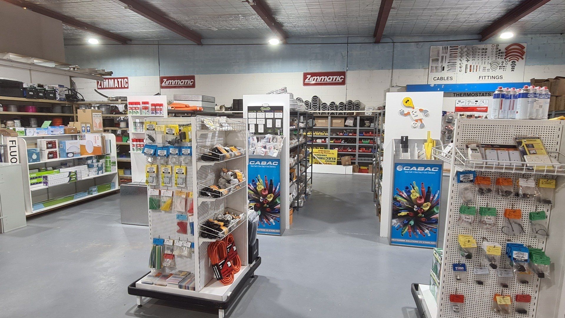 A store filled with lots of shelves and electrical supplies.