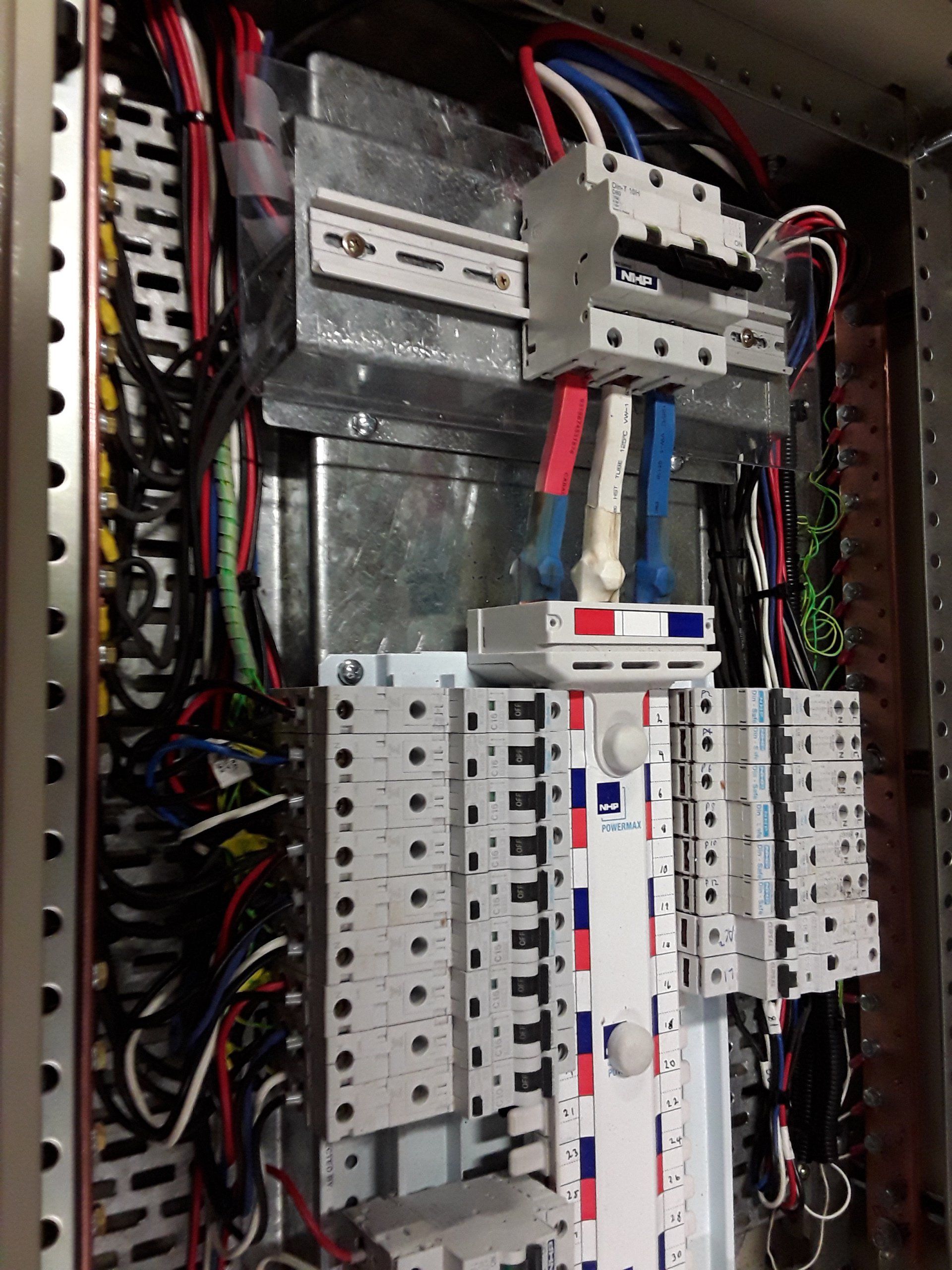 Electrical wires on a black board.