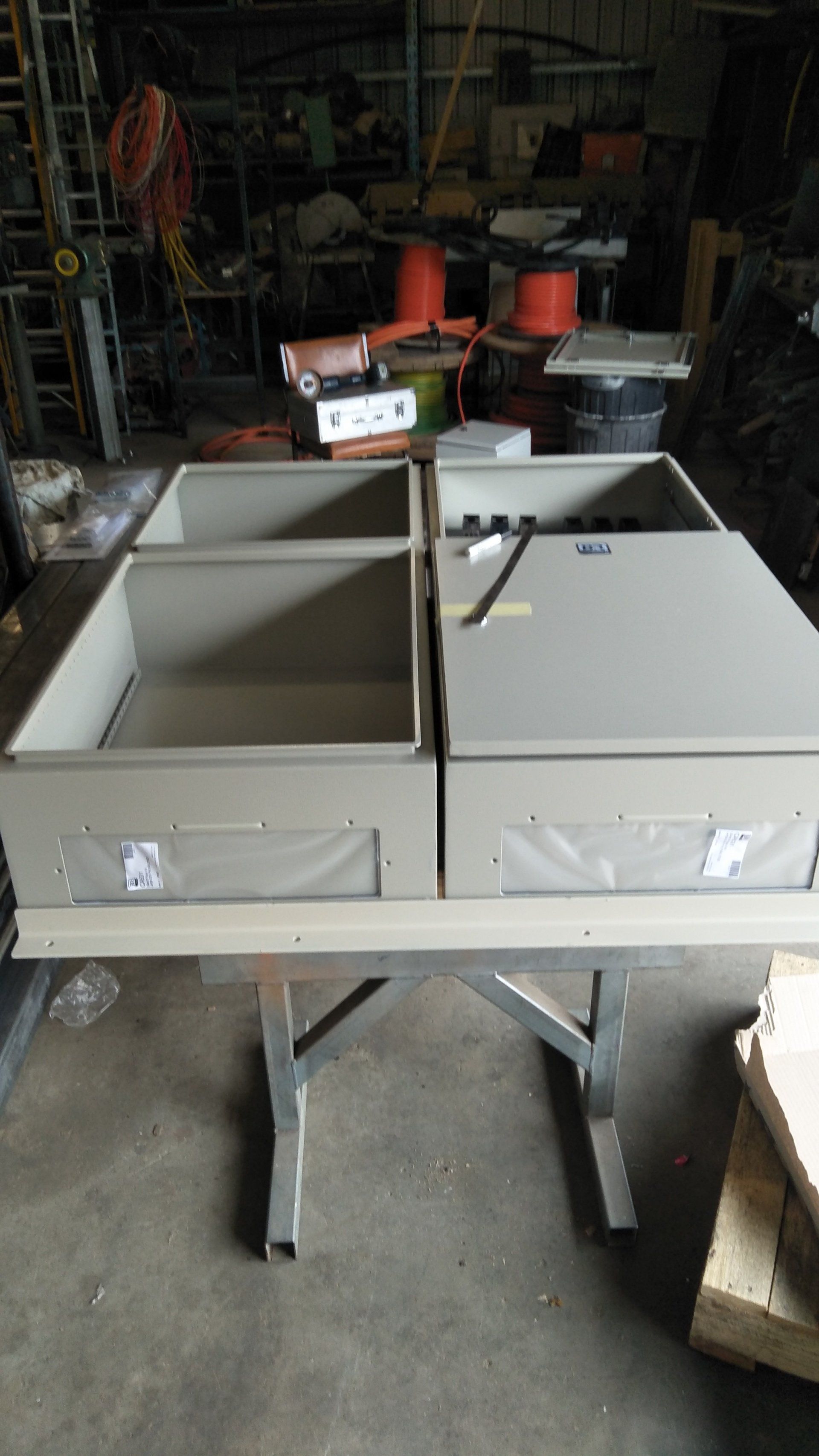 A table with a bunch of meter boxes on it.