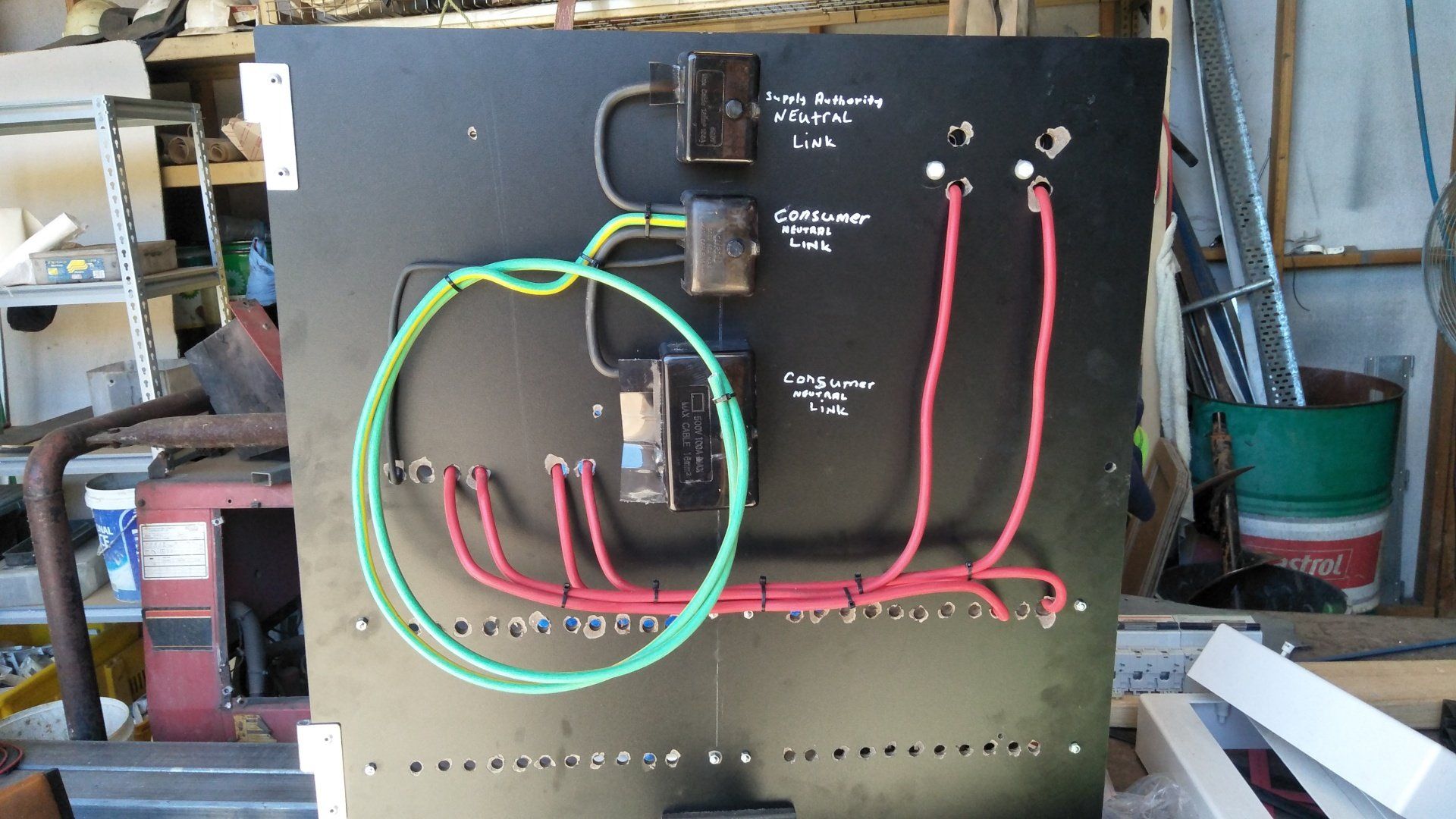 Electrical wires on a black board.