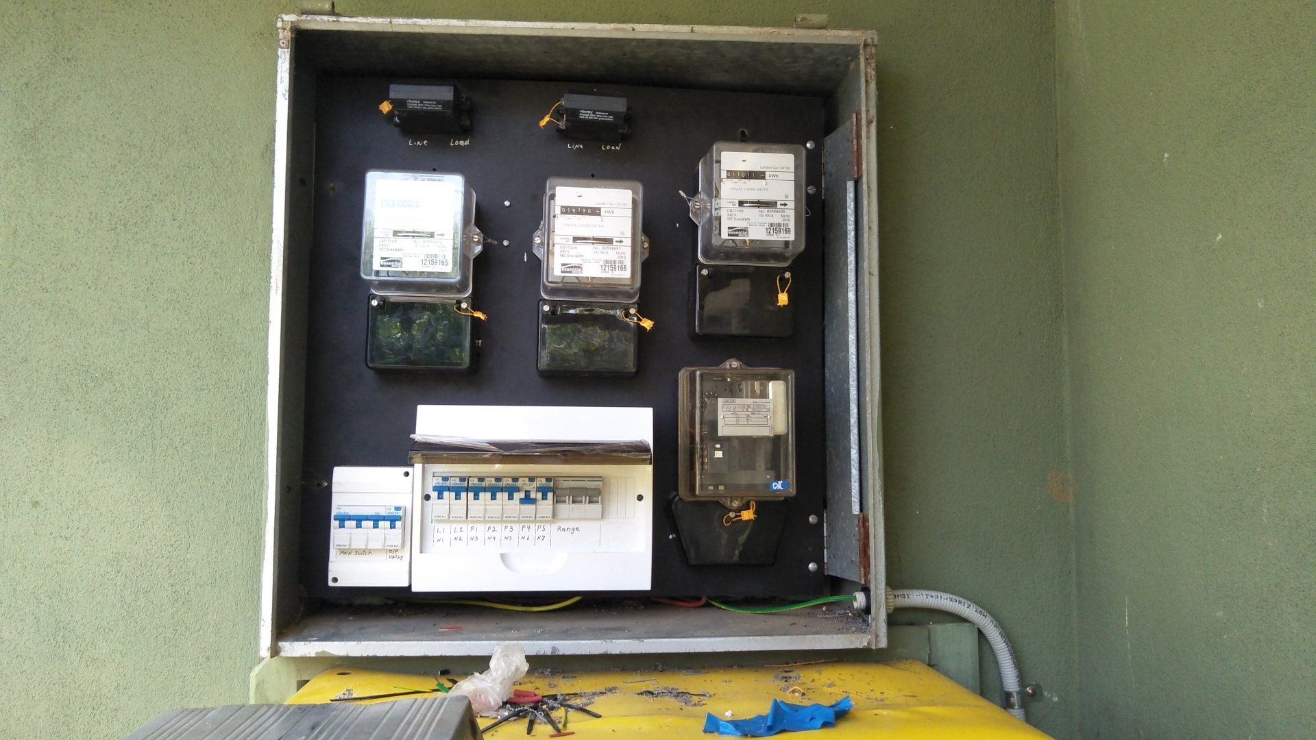 A black box with an electrical meter inside.