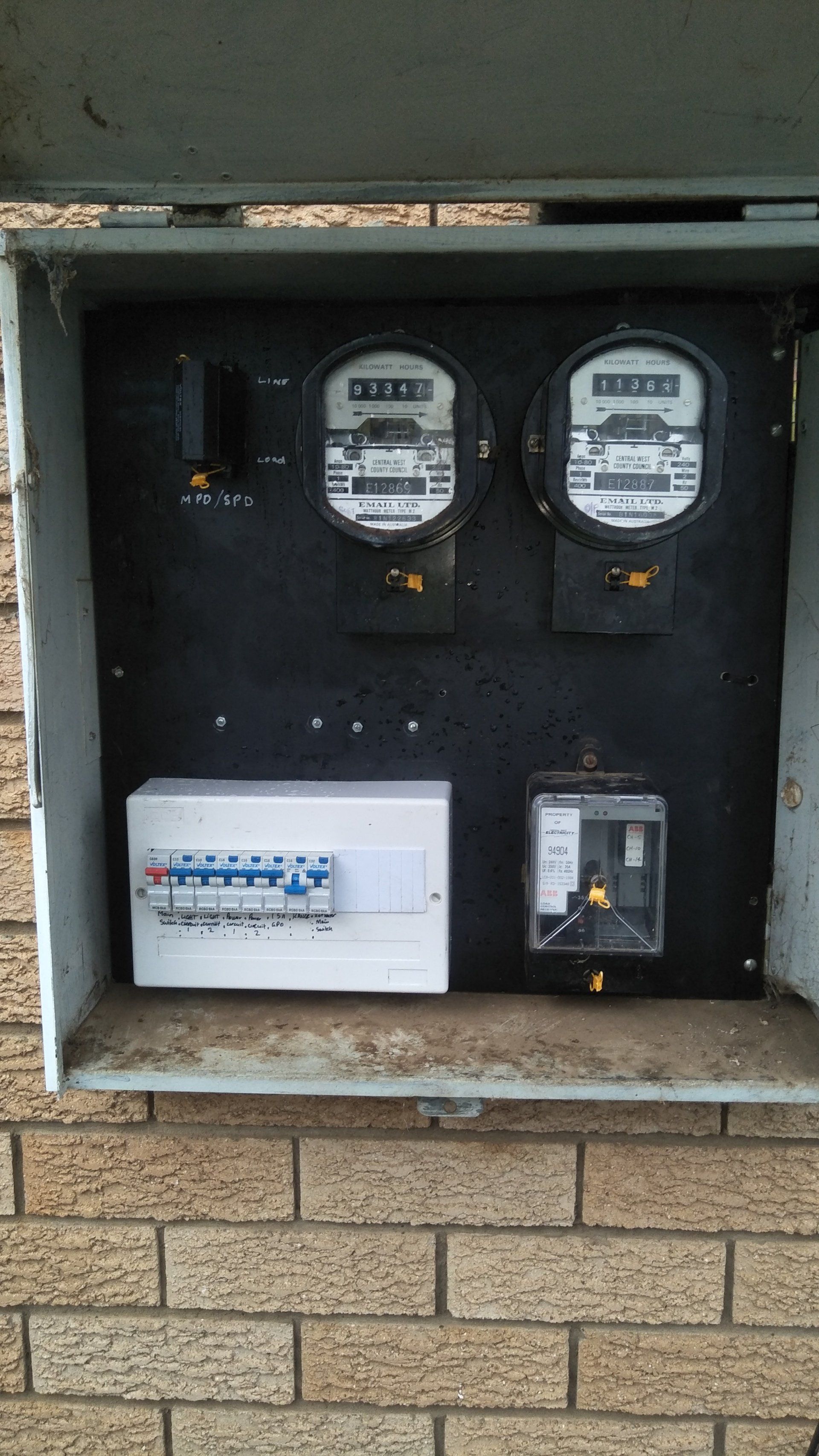A box filled with electrical meters .