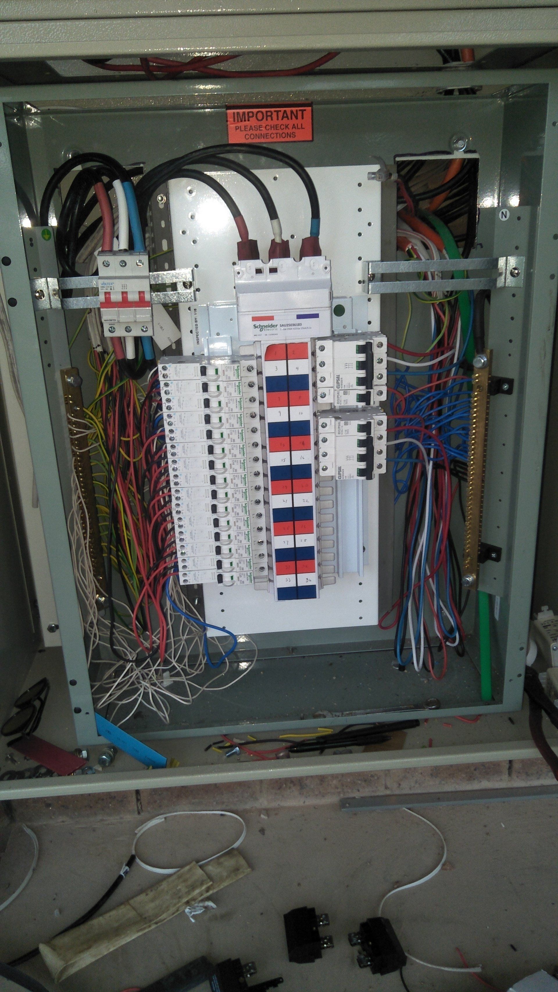A large electrical box filled with lots of wires.