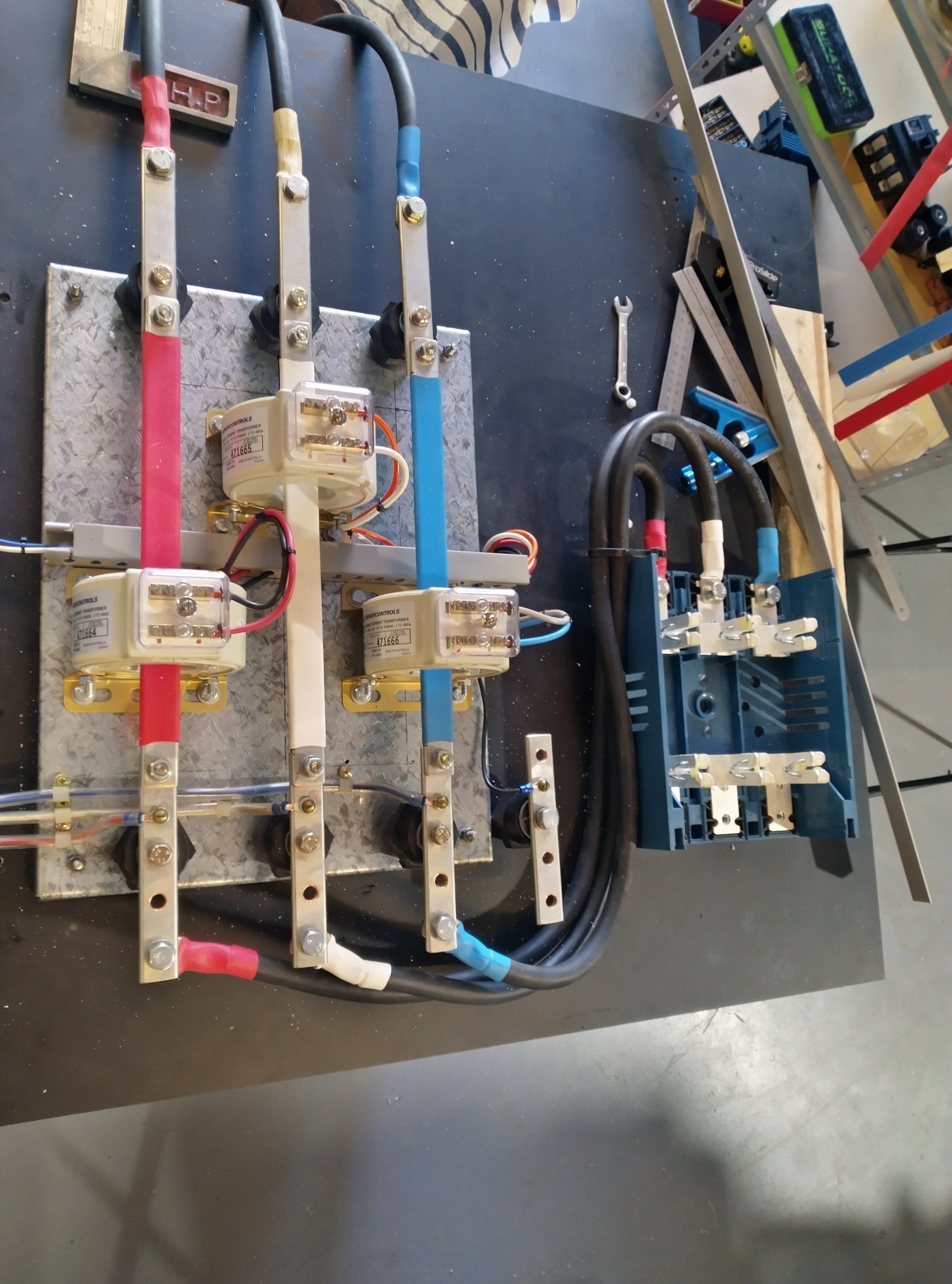 Electrical wires on a black board.