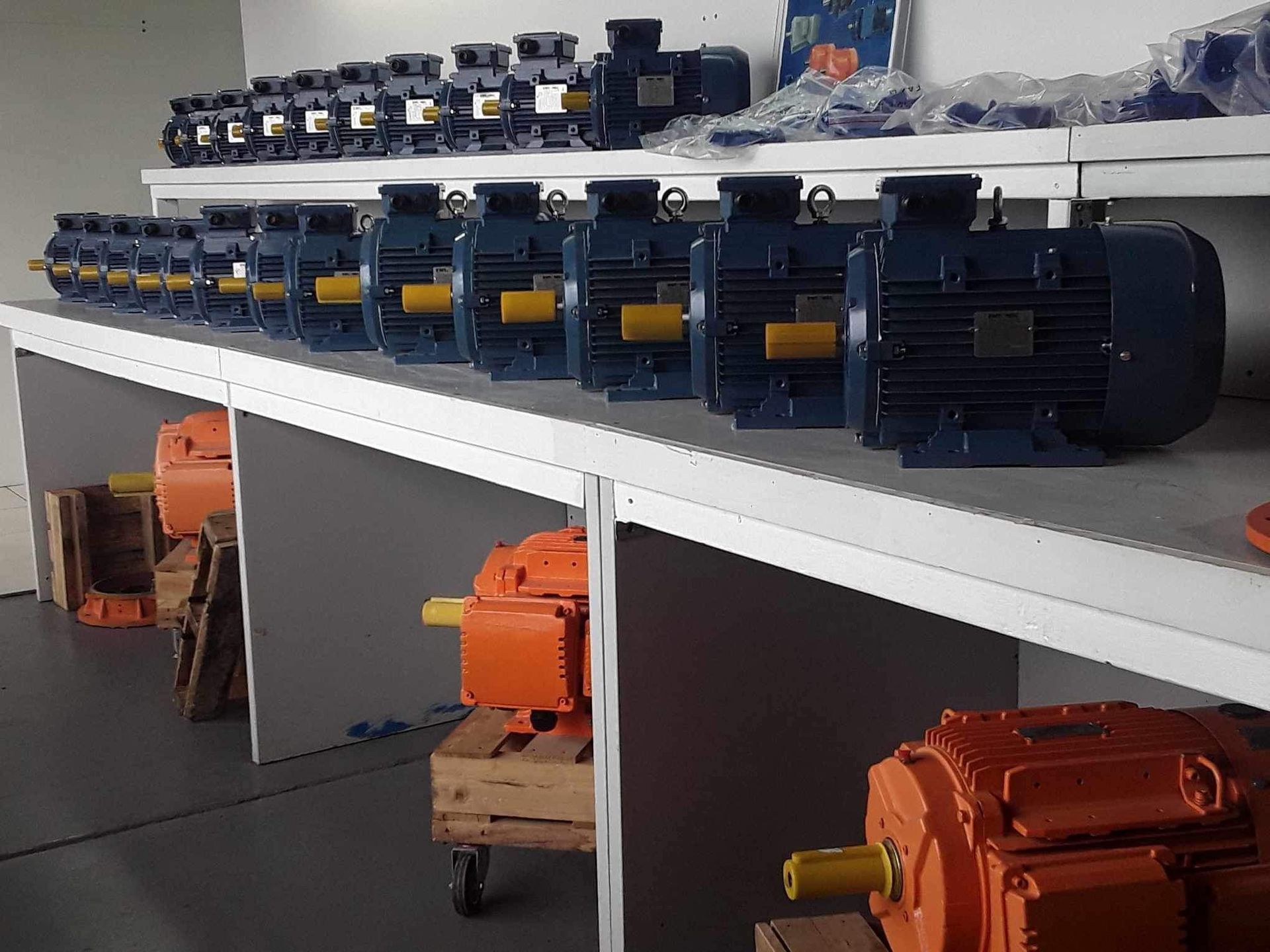 a bunch of motors lined up on a shelf