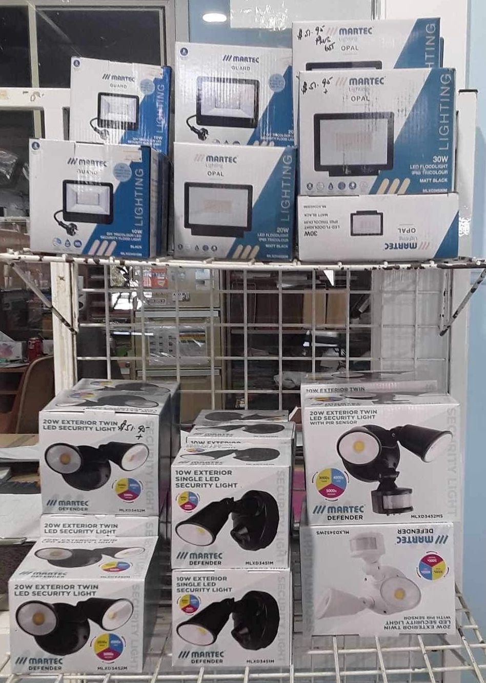 boxes of lights sitting on a shelf