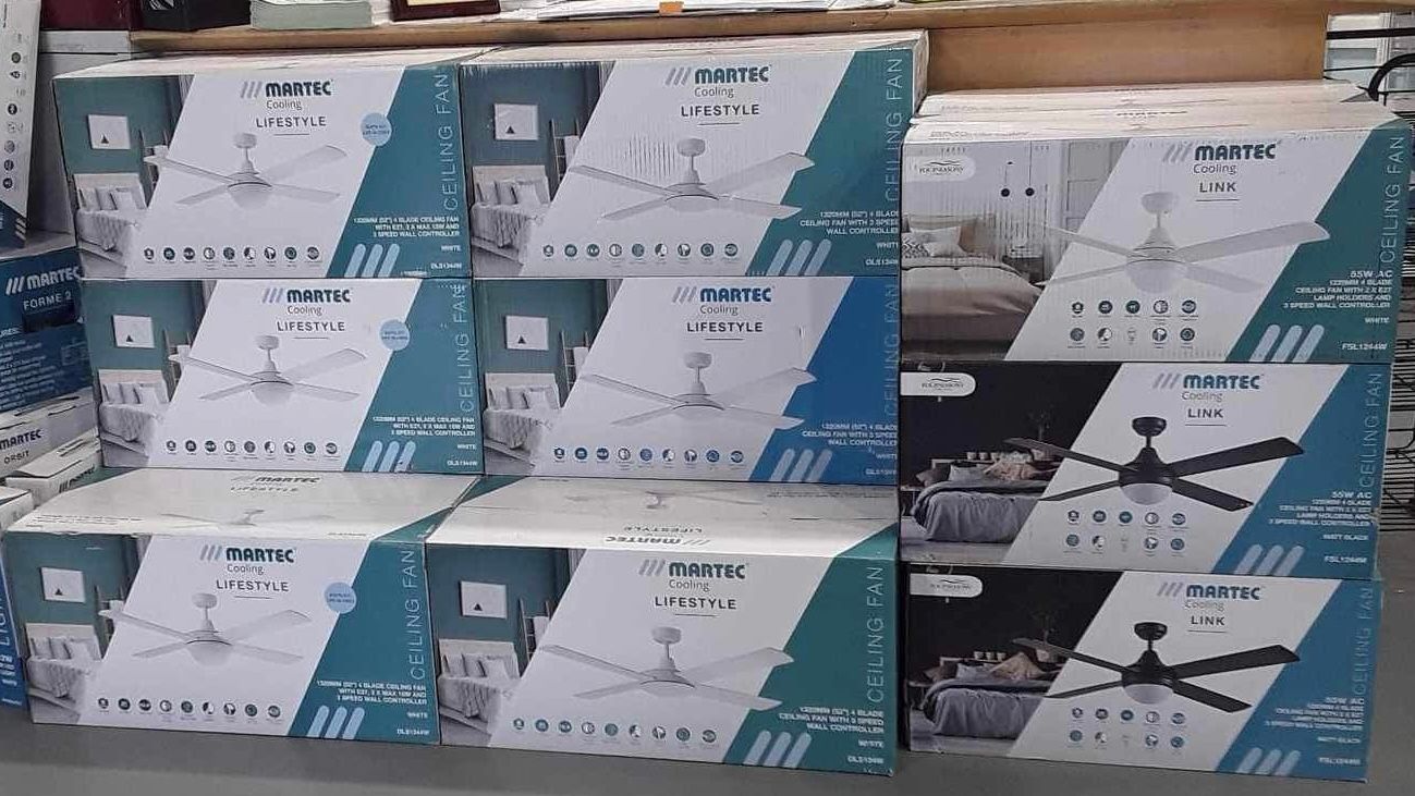 boxes of ceiling fans stacked on top of each other