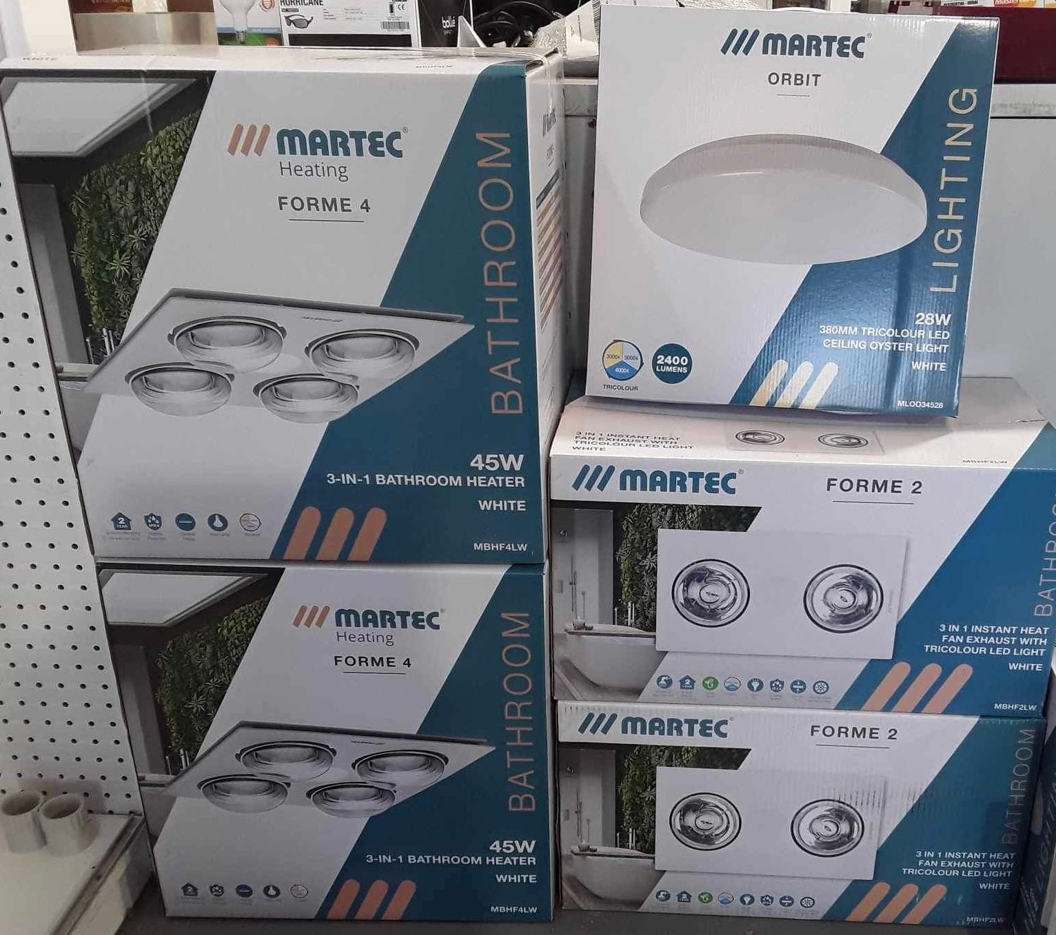 boxes of bathroom lighting stacked on top of each other