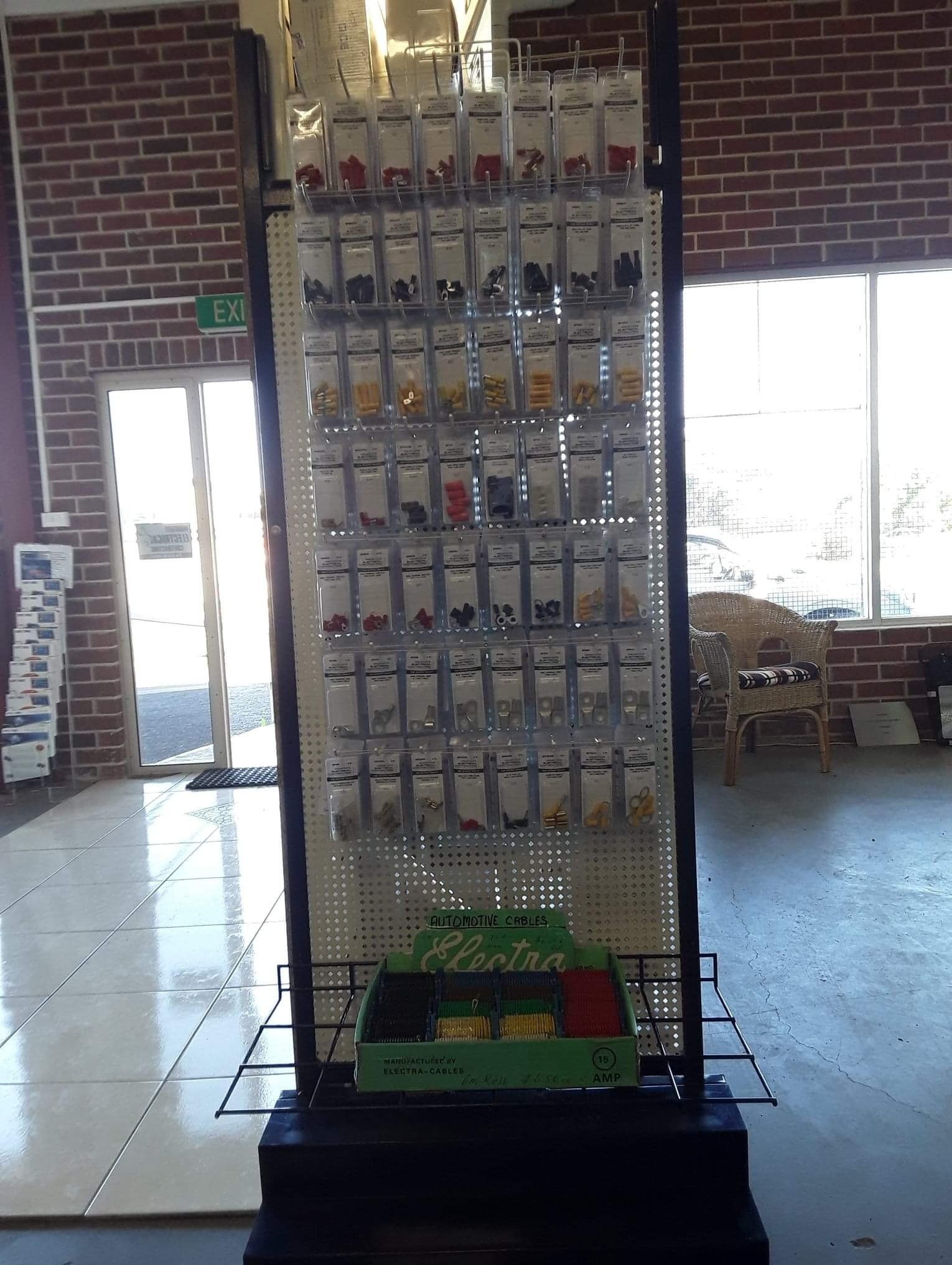 A store filled with lots of shelves and electrical supplies. 