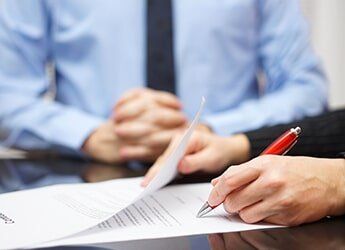 Woman Signing Will — Attorney in South Daytona, FL Woman Signing Will — Attorney in South Daytona, FL