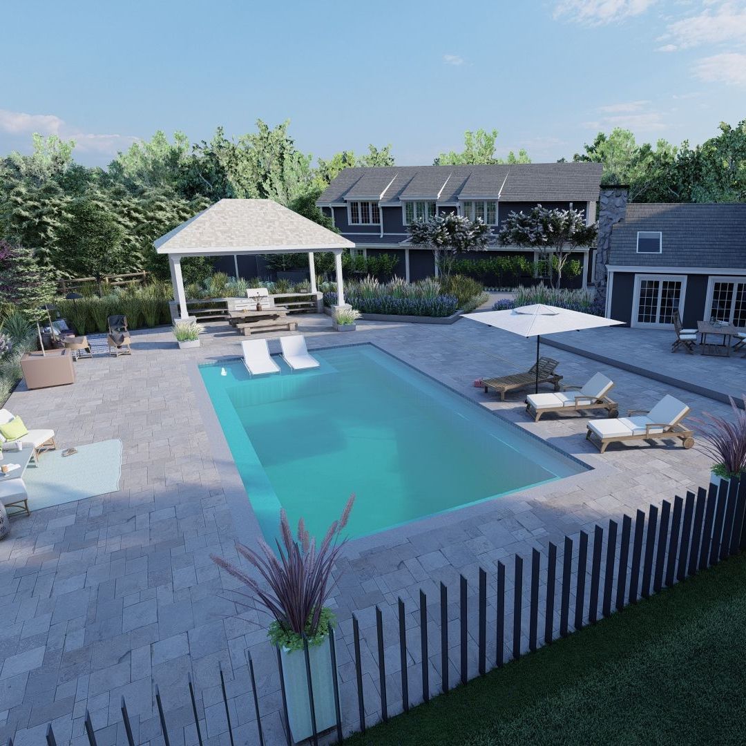 Tranquil backyard oasis featuring a pool and gazebo. Main Line Landscape Design.