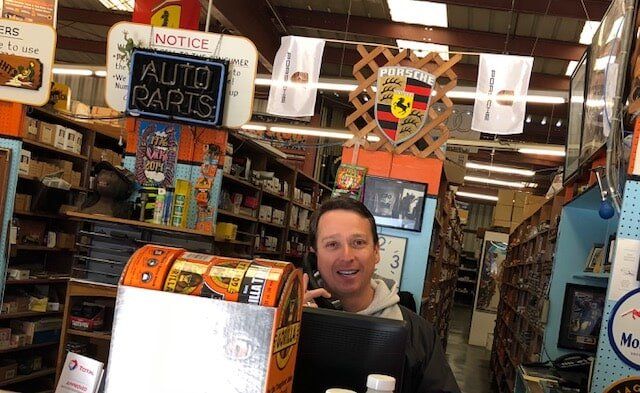 Guy Holding A Phone — Salinas, CA — Coast Automotive Warehouse